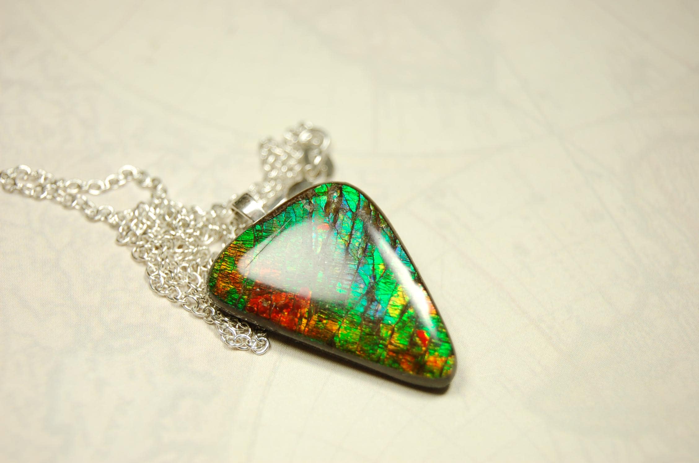 Natural Ammolite Gemstone Pendant from Alberta Canada with bright rich varied colors. A perfect Unisex  birthday gift. 032416
