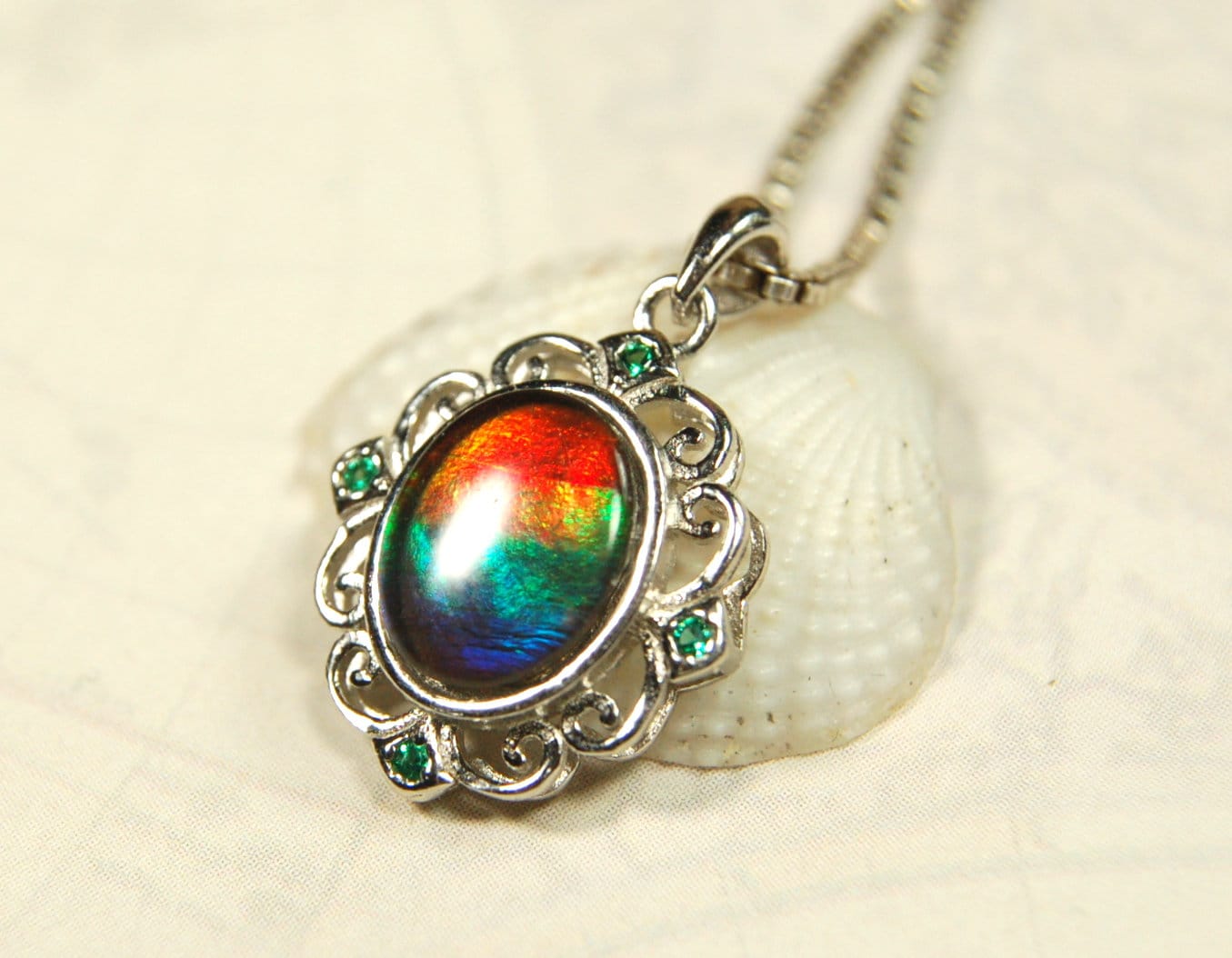 Ammolite Jewelry Pendant.Certified Authentic Canadian gem.White Gold Fill over Sterling silver setting.120213