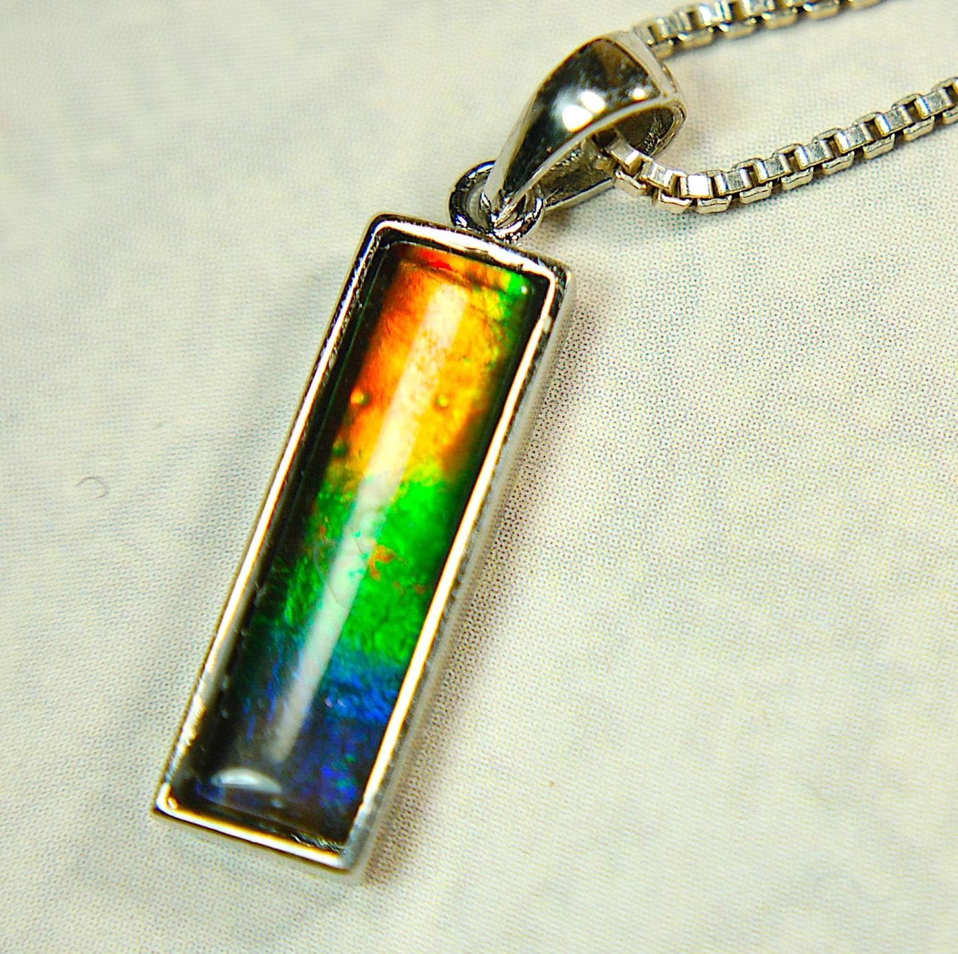 Lovely Ammolite pendant - the perfect gift for someone special.Sterling Silver plated with Rhodium so allergy free.052415