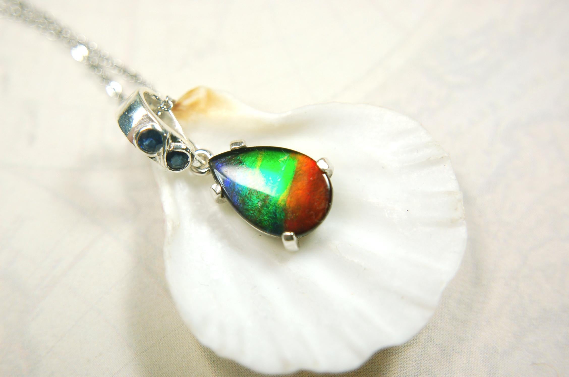 Ammolite Pendant Necklace.Sapphire studded bail.Brilliant rainbow colors.Sterling silver set.RARE gift for her.071115