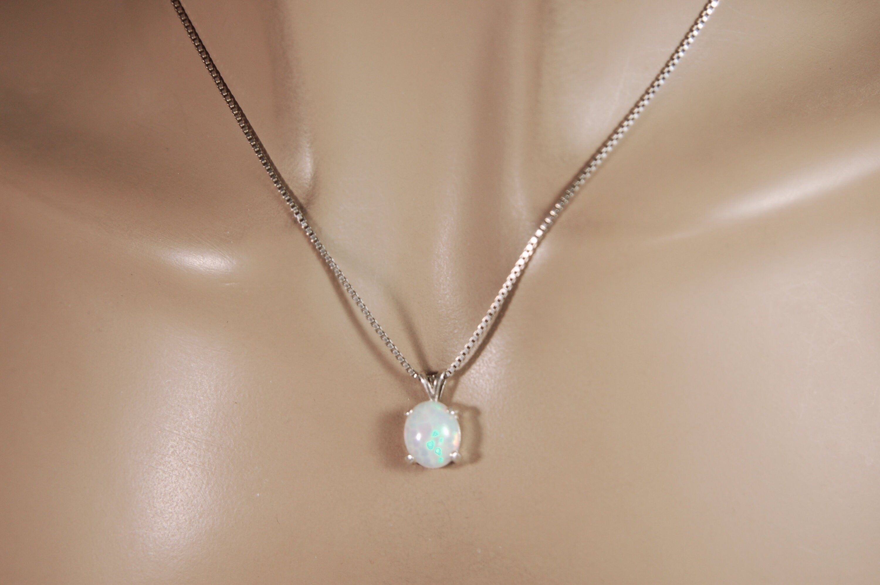 Opal pendant.Bright rolling colors. Desirable honeycomb gemstone.Perfect gift for her.MUST see colors in video.121213