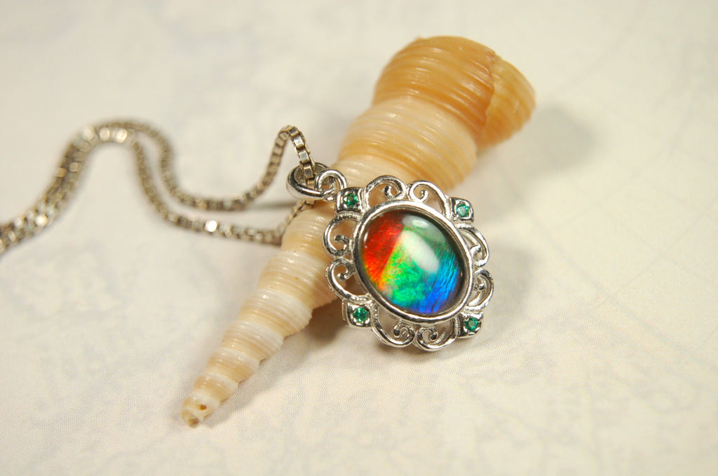 Ammolite Jewelry Pendant.Certified Authentic Canadian gem.White Gold Fill over Sterling silver setting.120213