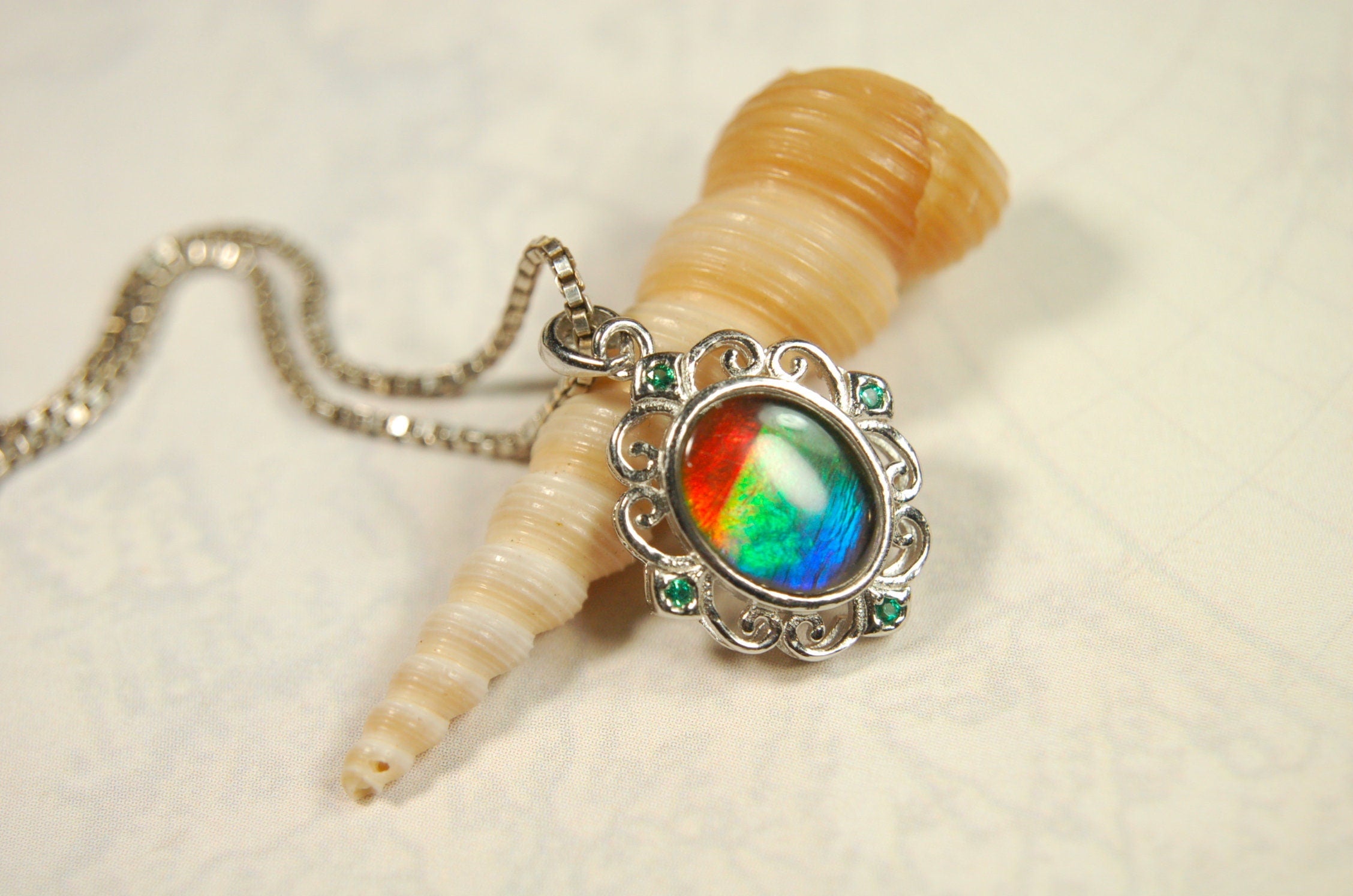 Ammolite Jewelry Pendant.Certified Authentic Canadian gem.White Gold Fill over Sterling silver setting.120213