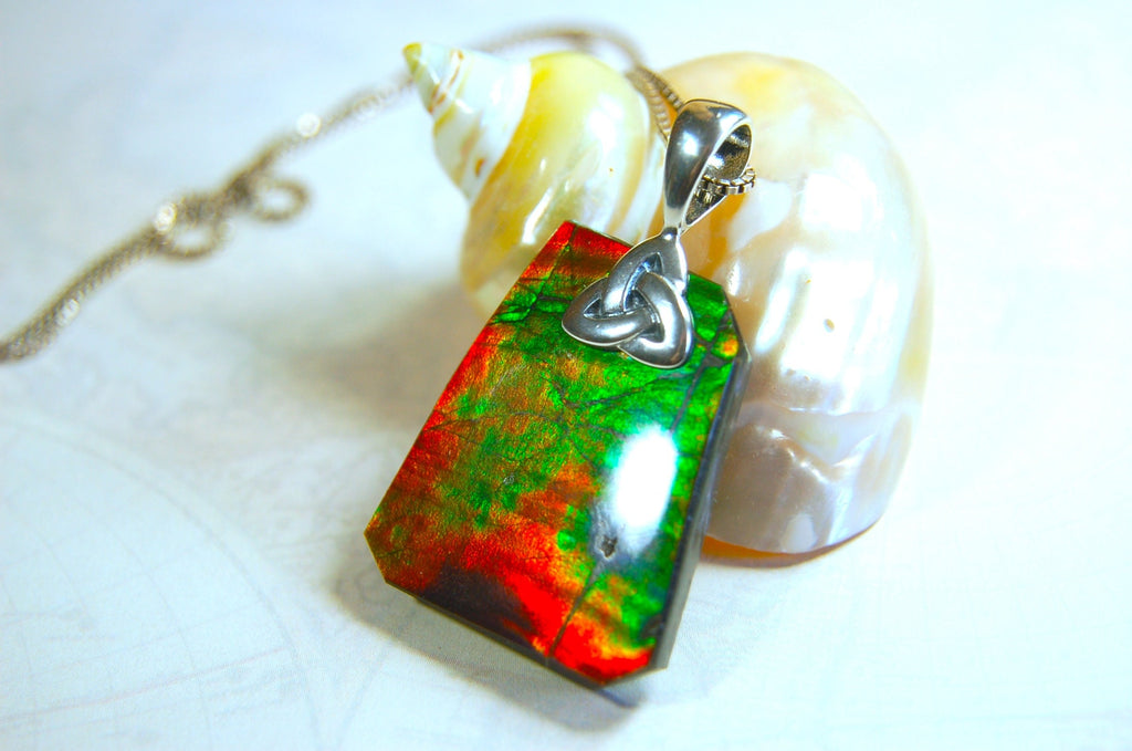 Natural Ammolite Cabochon Pendant necklace with deep rich colors.Heavy sterling silver Celtic Bail.Gift for wife? Must see video.032514
