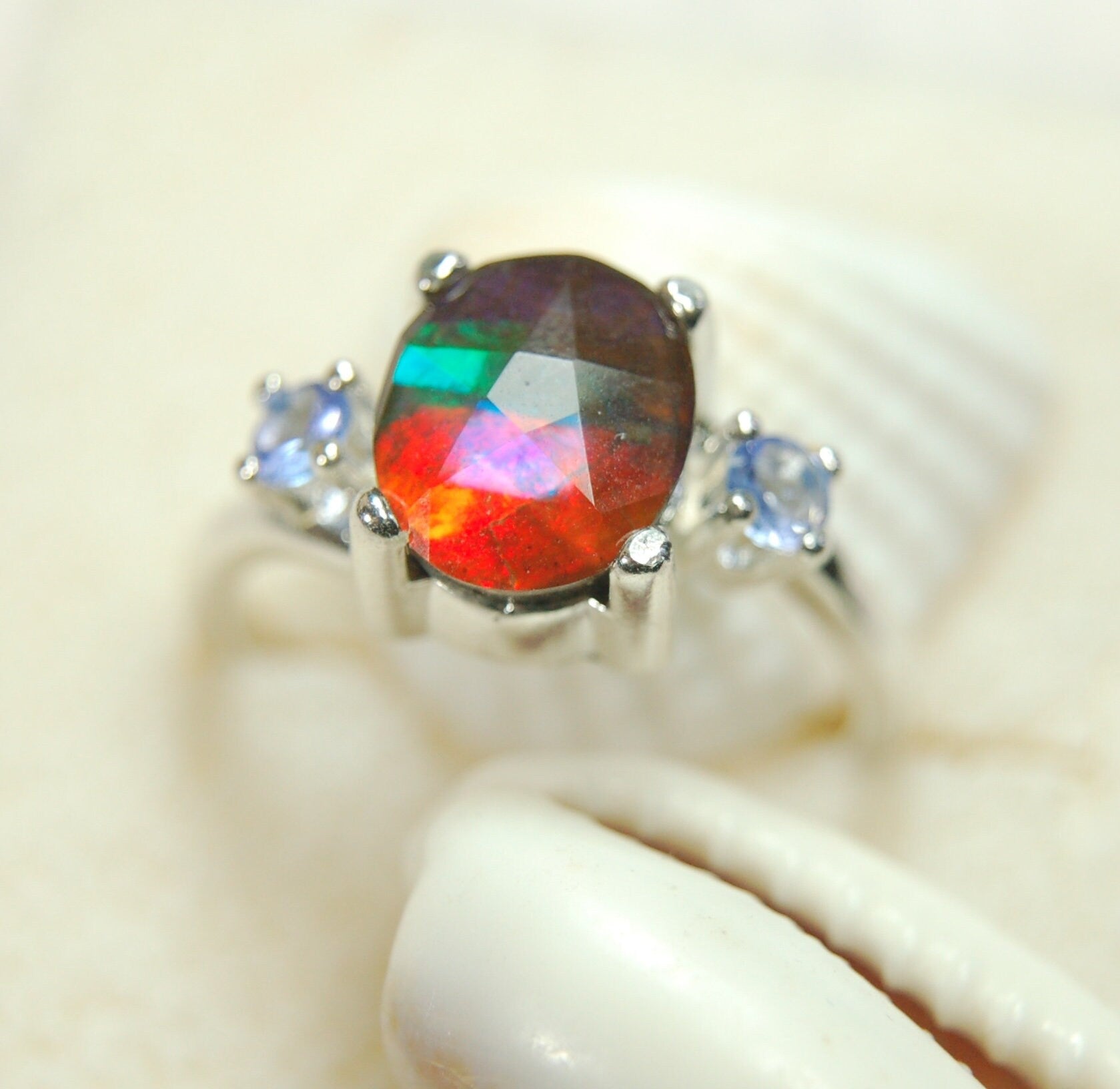 Ammolite Jewelry Ring with Tanzanites.No import taxes under CUSMA rules.022414