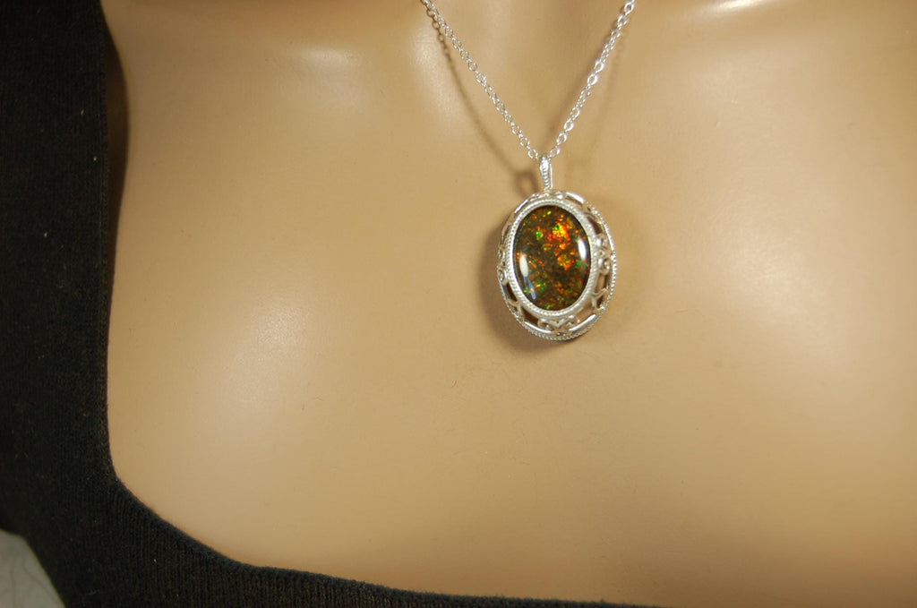 Unusual Ammolite pendant full of multicolor sparkles.A gift that will be treasured..032116