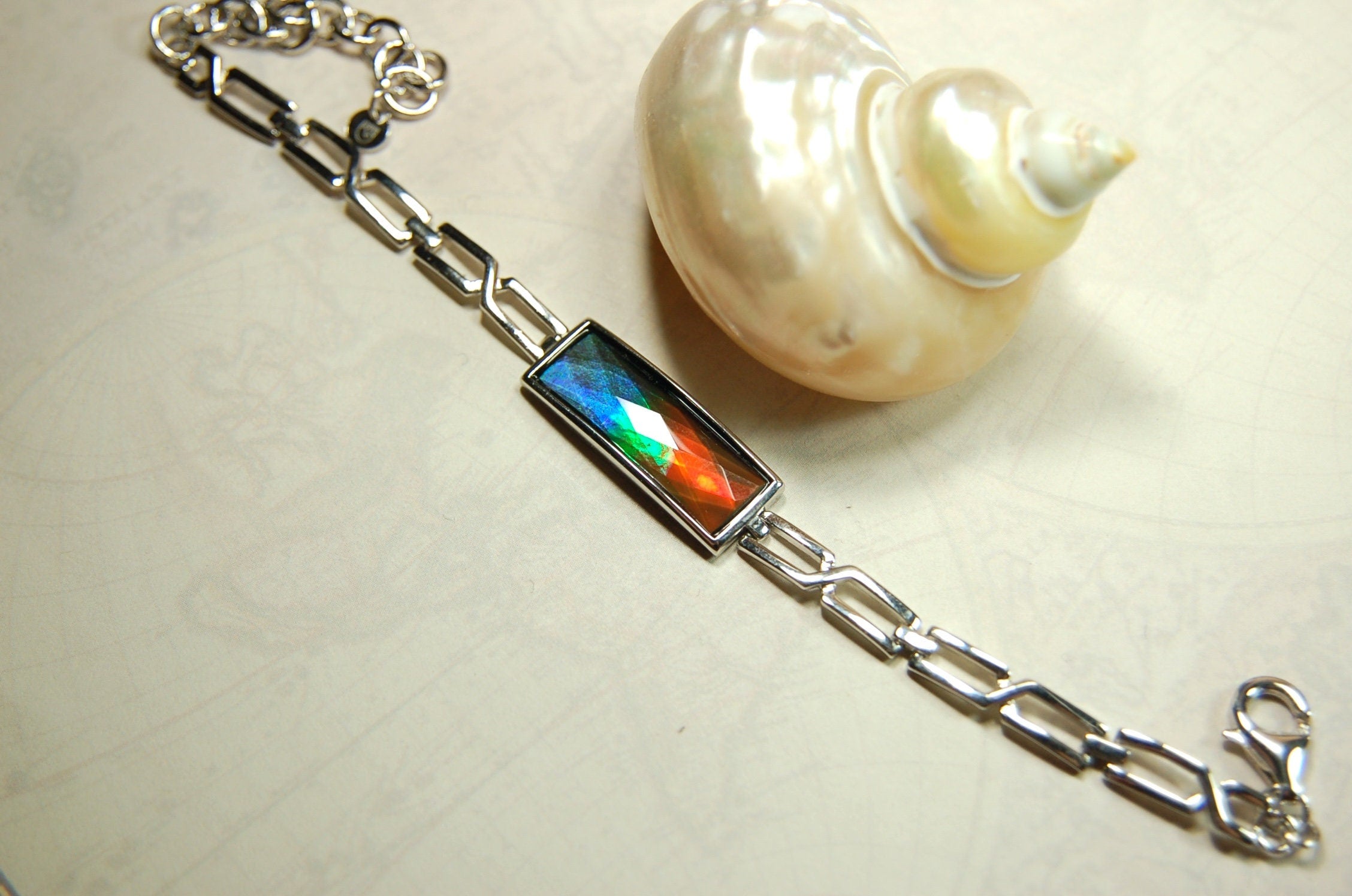 Ammolite Jewelry bracelet.Bright faceted gem shipped free.No import tax to US under CUSMA exemption #070614