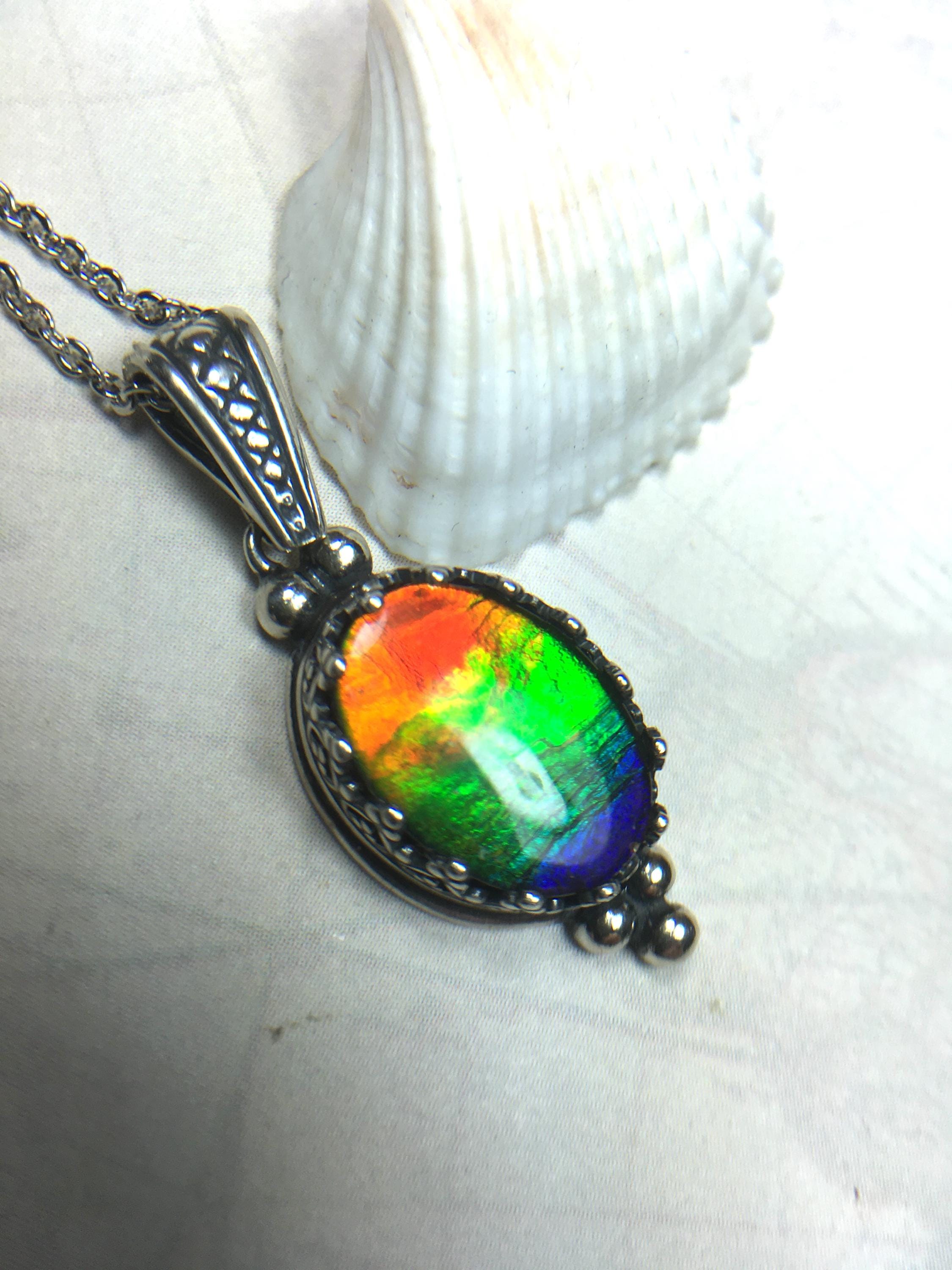 Genuine Ammolite Jewelry Pendant.Rainbow gem.Sterling Silver setting.No import taxes under CUSMA rules.062815