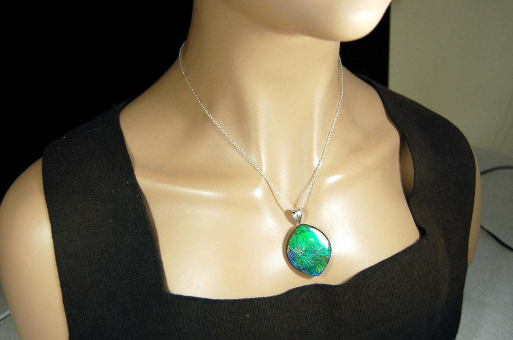 Ammolite pendant for lovers of green this is the one.High quality genuine gem from Alberta Canada.Big impact pendant.021226