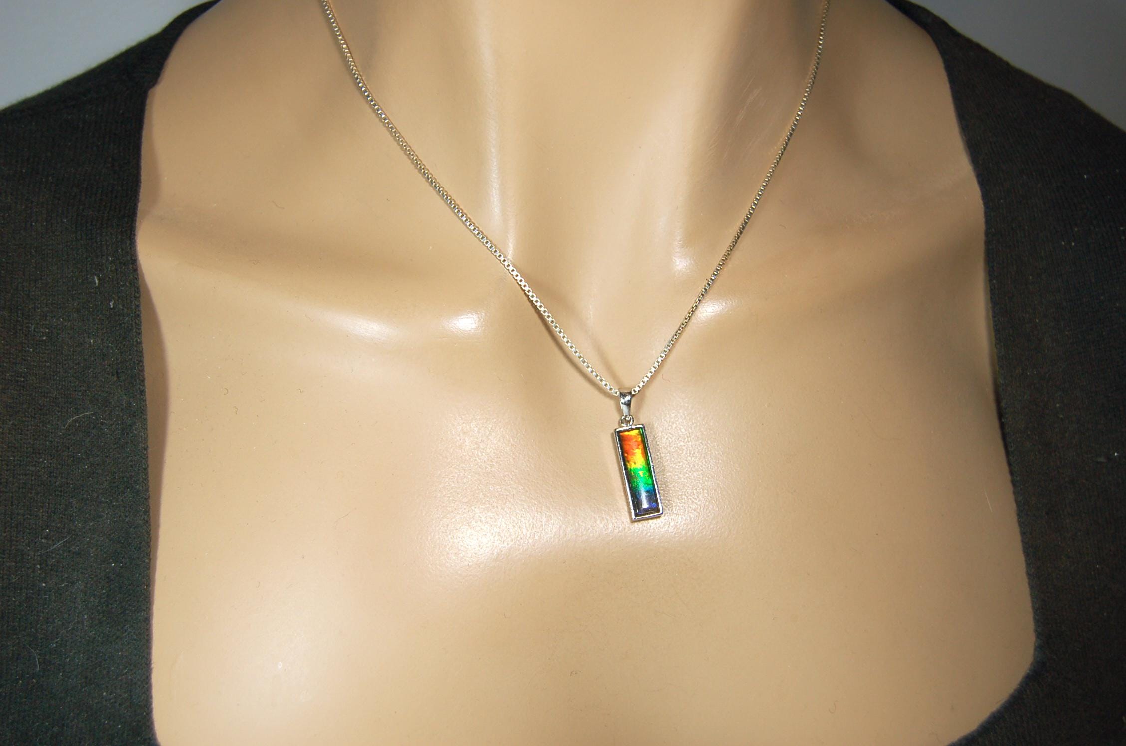 Lovely Ammolite pendant - the perfect gift for someone special.Sterling Silver plated with Rhodium so allergy free.052415