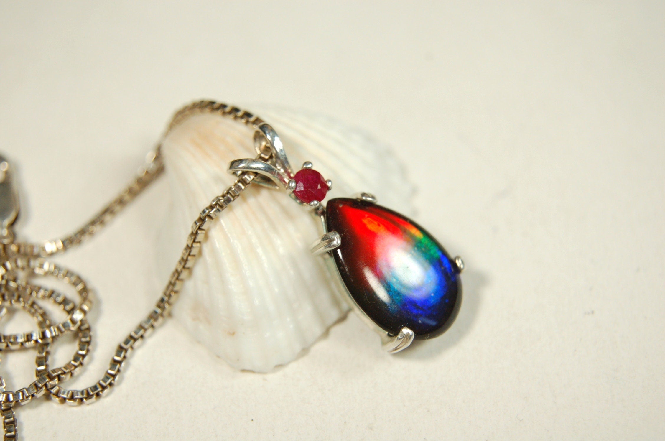 Ammolite Raibow pendant.Natural ruby companion stone.Lots of bright colors.#110317
