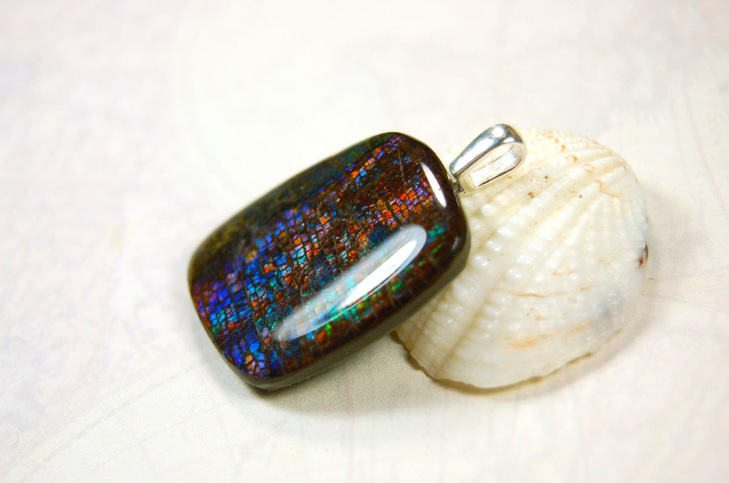 Ammolite Pendant Necklace.RARE Natural gem with brilliant sparks of color on black background.--071815