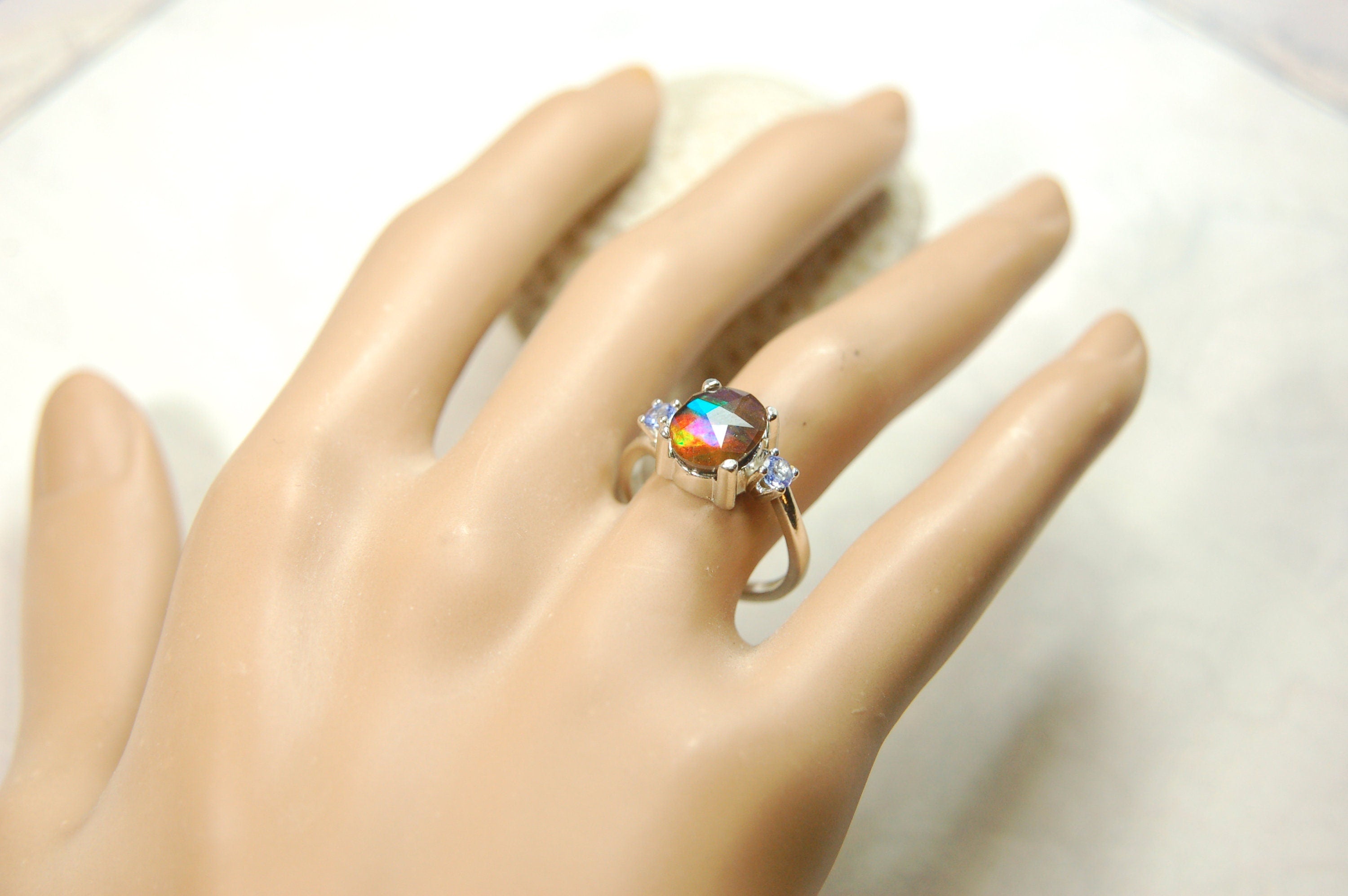 Ammolite Jewelry Ring with Tanzanites.No import taxes under CUSMA rules.022414