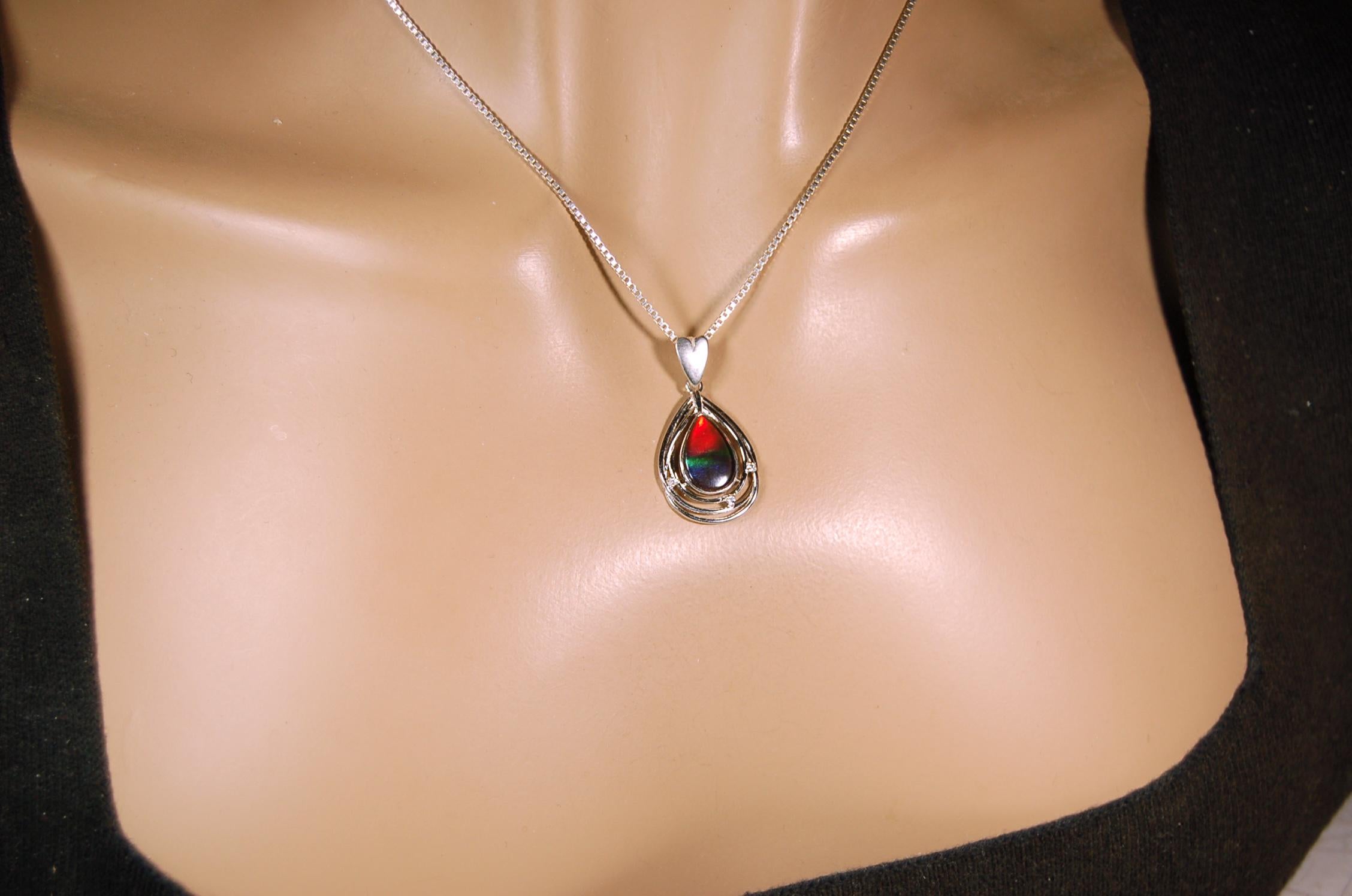 Eye-Catching Ammolite Pendant gift for Mothers Day she will treasure.Genuine Ammolite mined, finished and shipped from Canada 032015