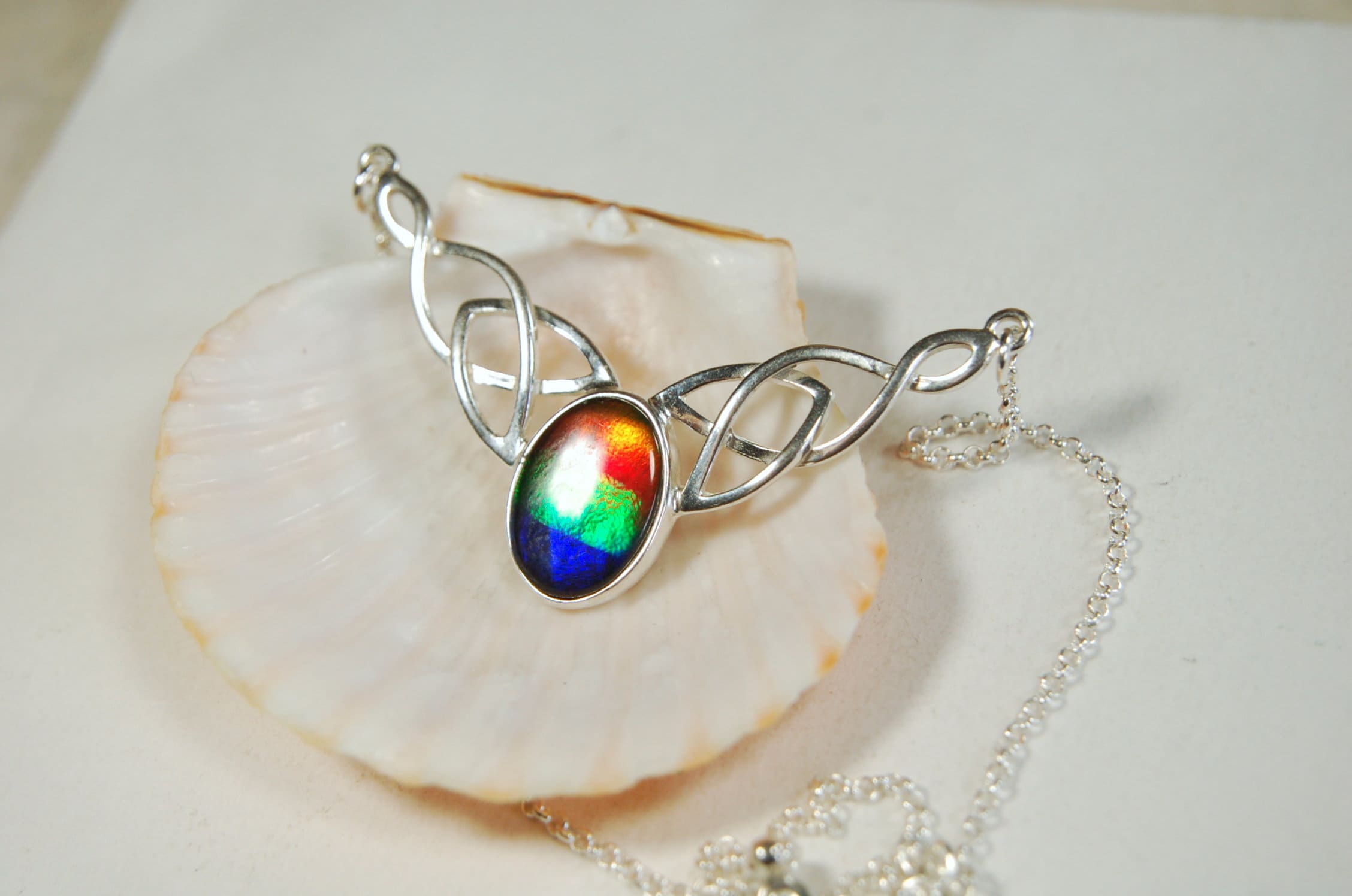 Ammolite Jewelry Necklace of the much admired Rainbow type.Four colors. Lovely Celtic setting with extender.#042513
