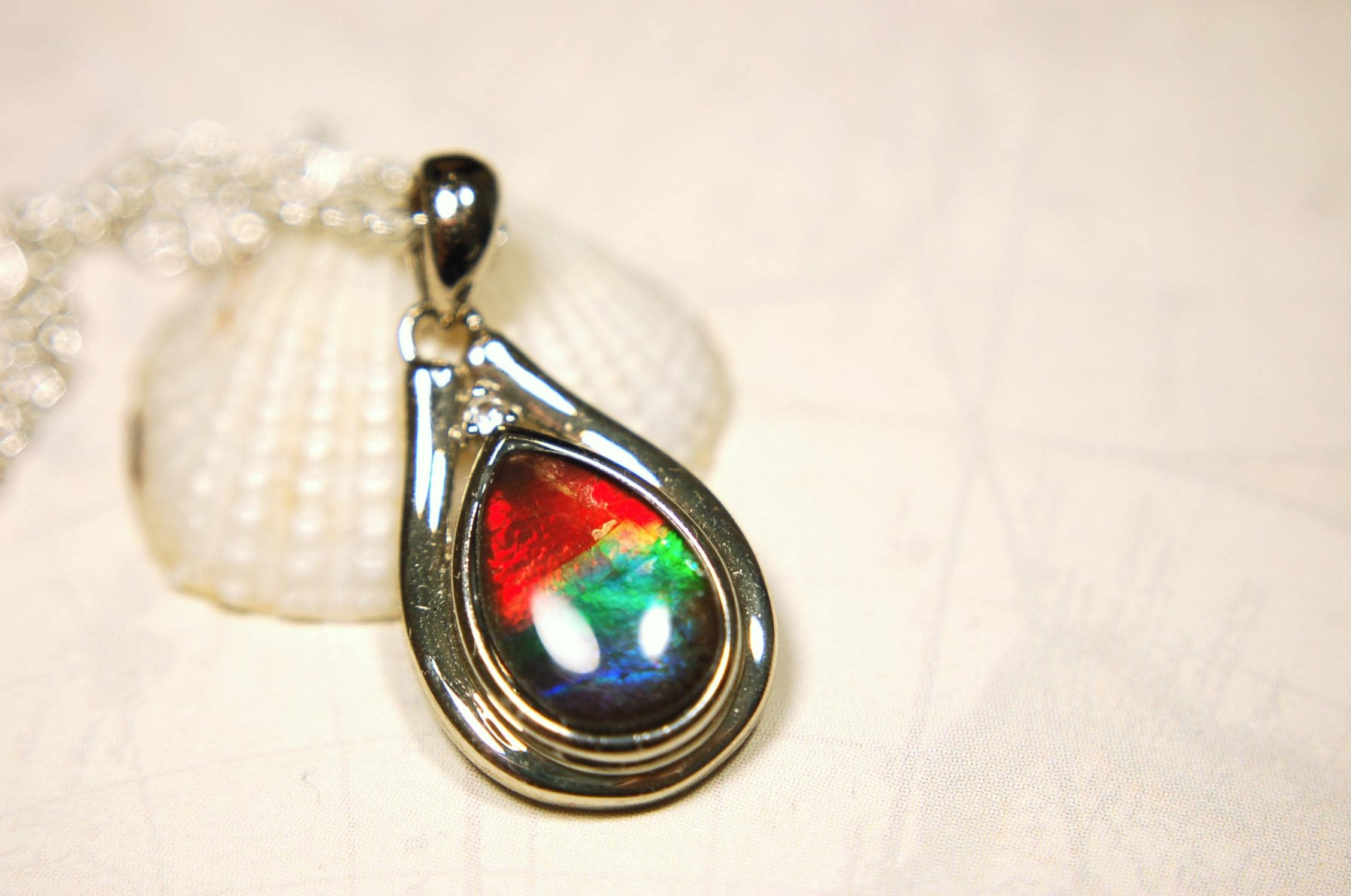 Ammolite pendant.Petite,feminine but very powerful.Rainbow color gem with sapphire.Birthday or Anniversary Gift for wife? 030416