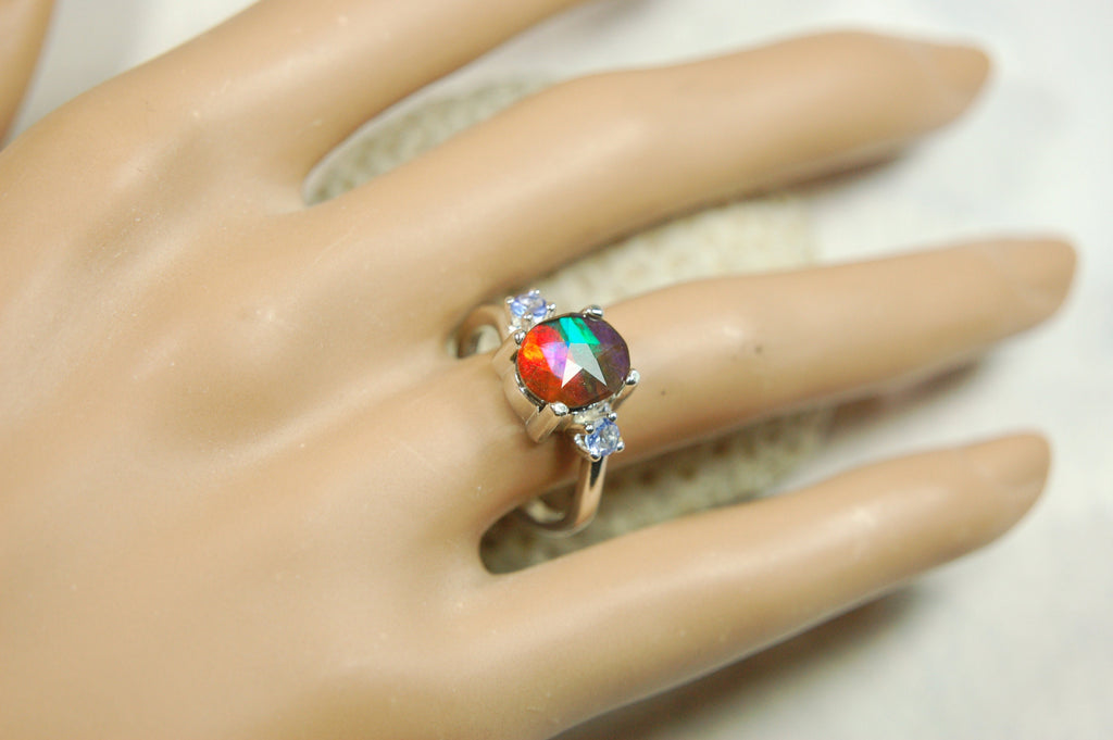 Ammolite Jewelry Ring with Tanzanites.No import taxes under CUSMA rules.022414