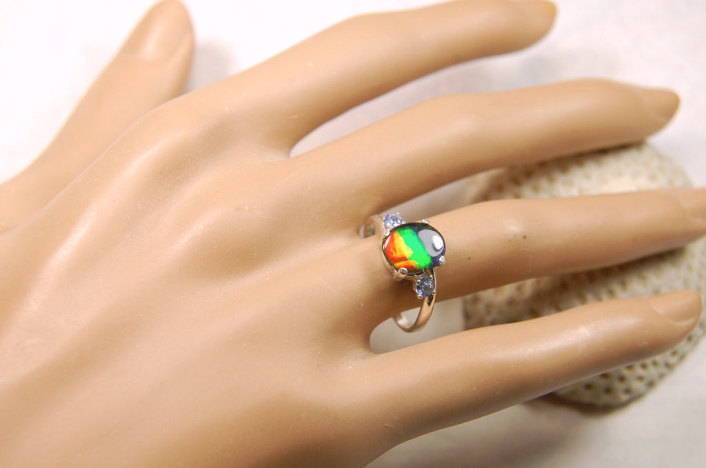 Ammolite Ring with brilliant colors and Tanzanite side stones.Size 7 #120223