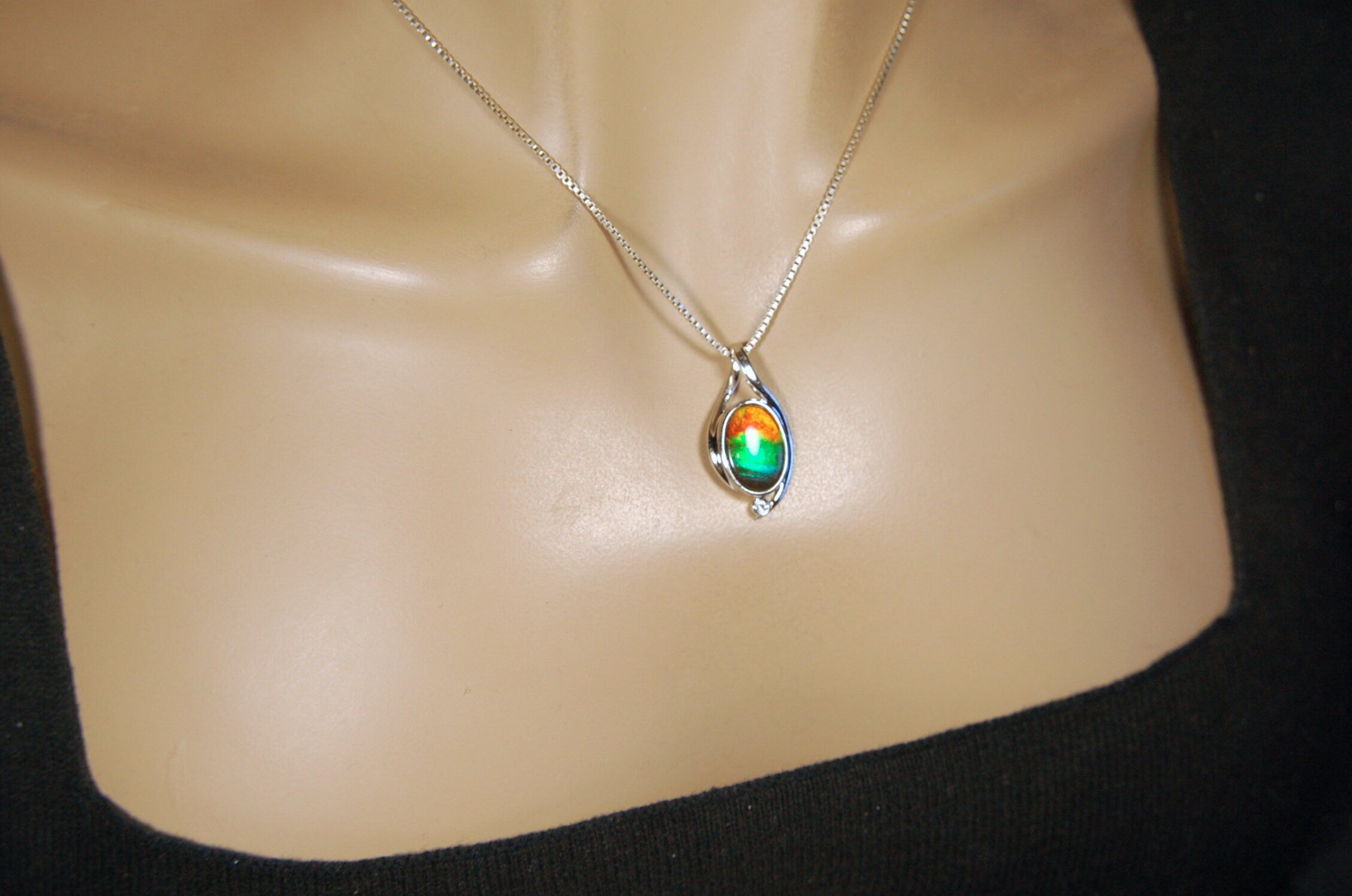 Ammolite Jewelry Pendant.Strong colors.Quality sterling Allergy free silver setting.Shipped free.071612