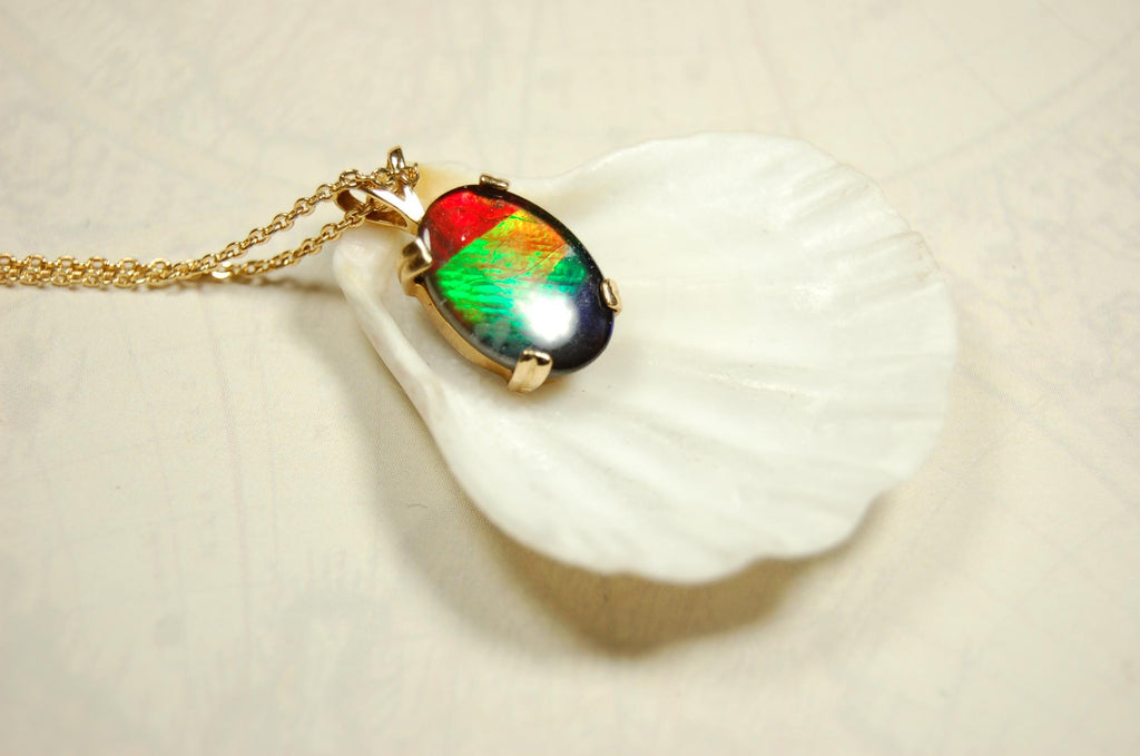 Ammolite necklace pendant in solid 10k yellow gold.A gift your wife will treasure.Brilliant color changer. 071601