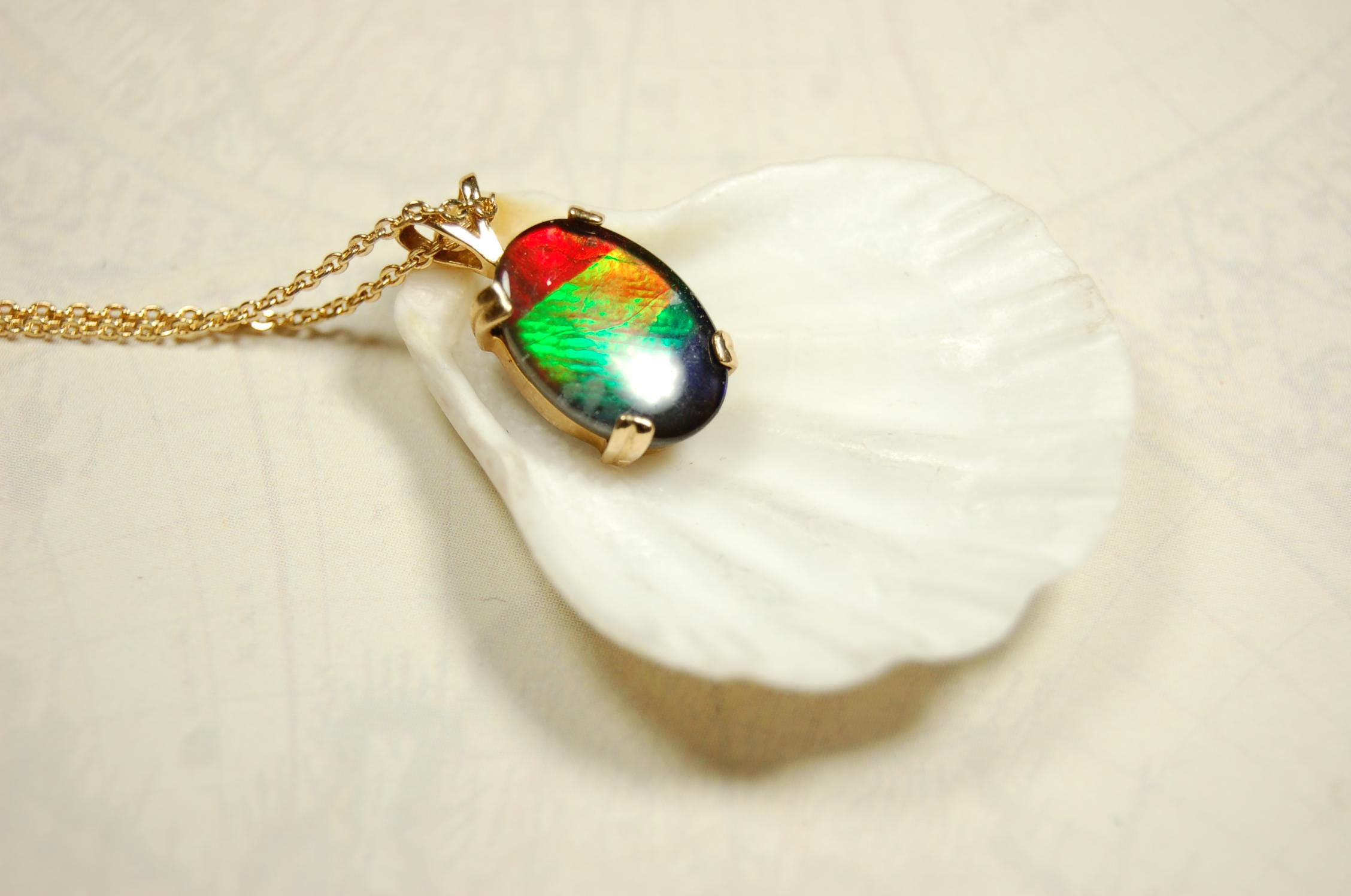 Ammolite necklace pendant in solid 10k yellow gold.A gift your wife will treasure.Brilliant color changer. 071601