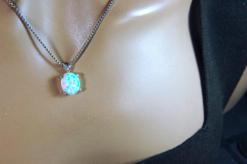 Opal pendant.Bright rolling colors. Desirable honeycomb gemstone.Perfect gift for her.MUST see colors in video.121213