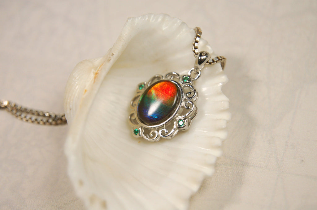 Ammolite Jewelry Pendant.Certified Authentic Canadian gem.White Gold Fill over Sterling silver setting.120213