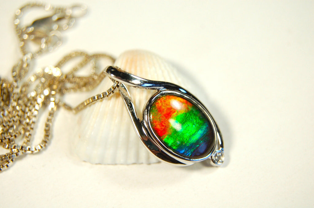Ammolite Jewelry Pendant.Strong colors.Quality sterling Allergy free silver setting.Shipped free.071612