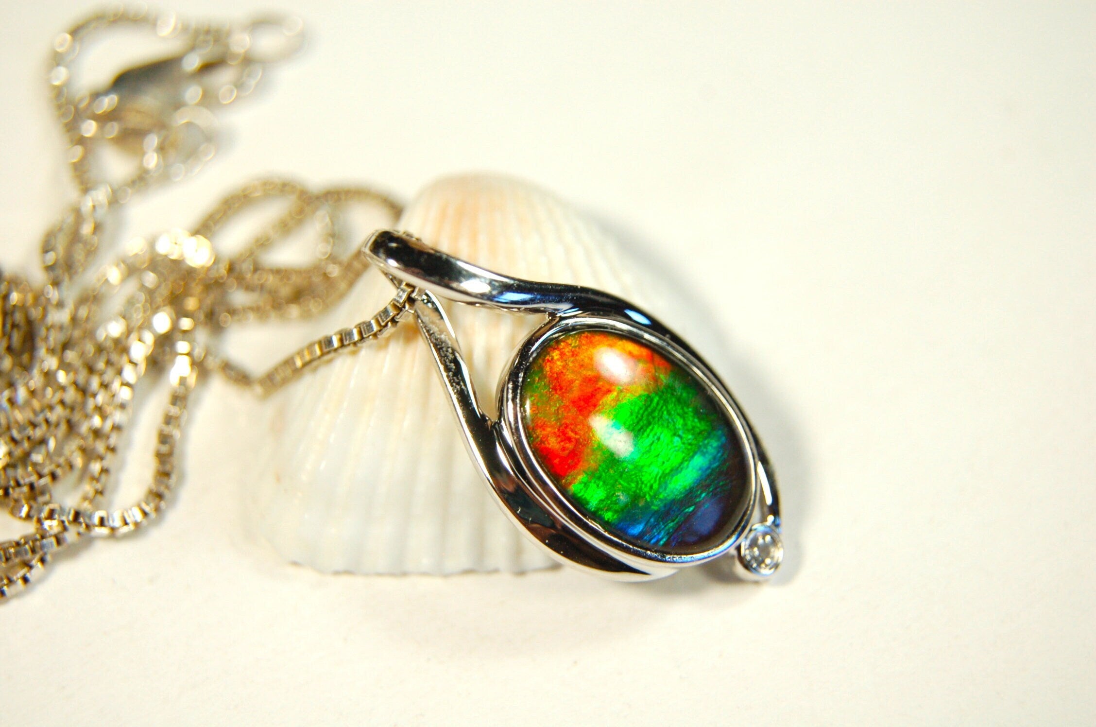 Ammolite Jewelry Pendant.Strong colors.Quality sterling Allergy free silver setting.Shipped free.071612
