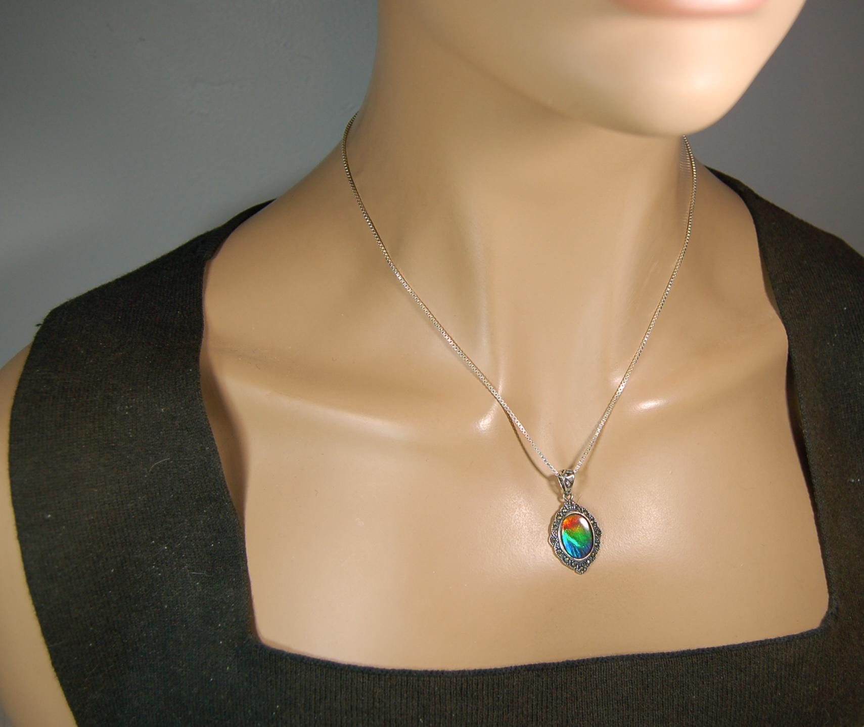Ammolite jewelry pendant-a wifes birthgay gift Idea she will treasure.Genuine high quality ammolite mined and shipped from Canada.013115