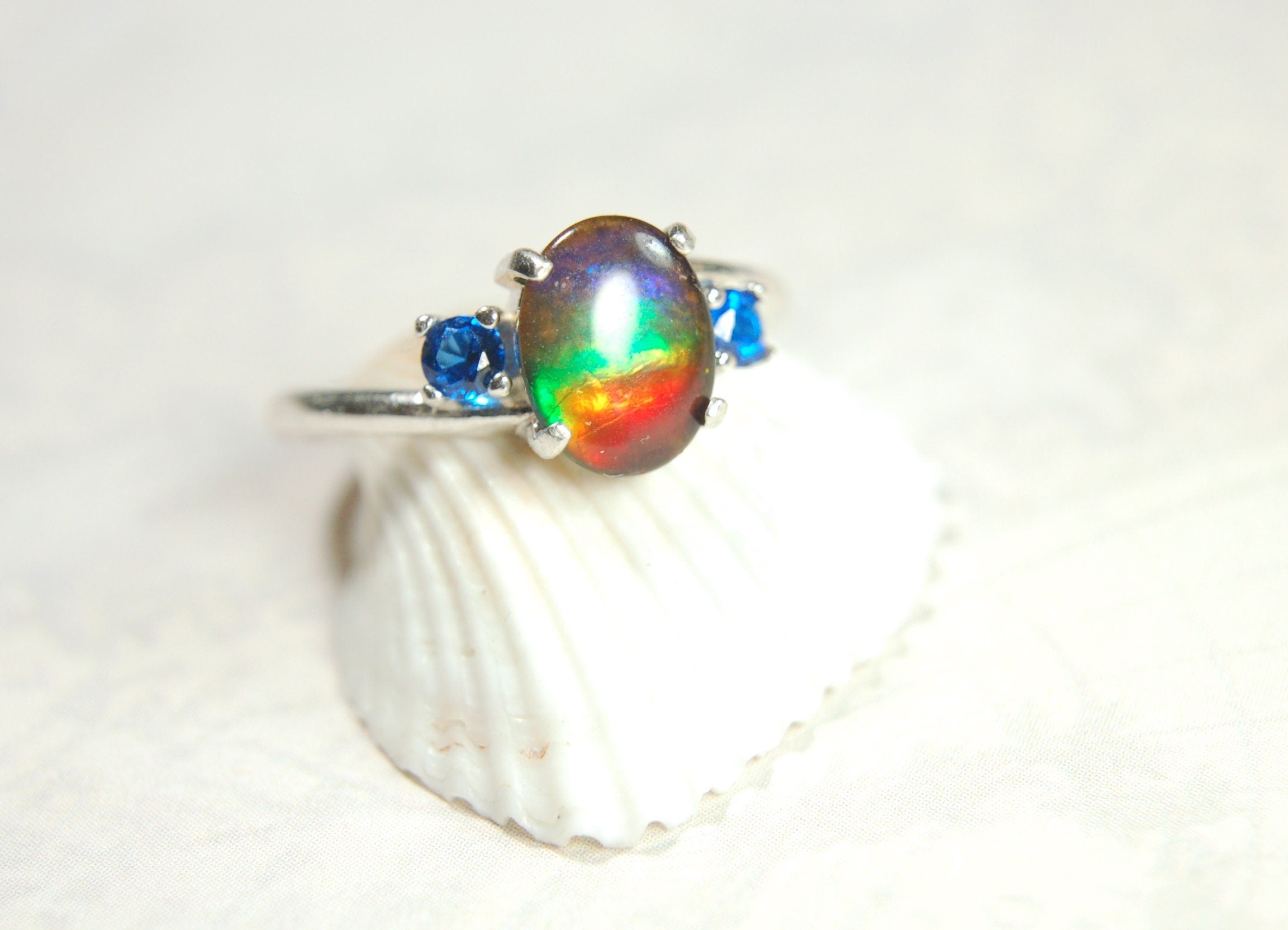 Ammolite Ring with brilliant Spinel side stones.Size 7.