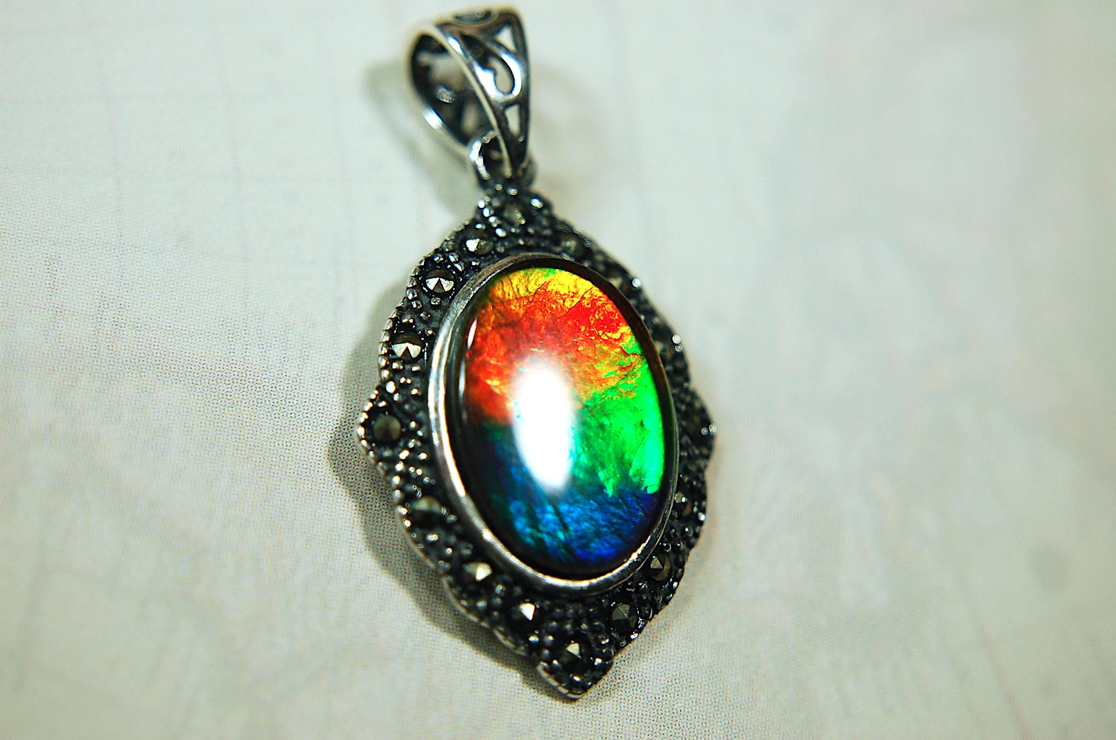 Ammolite jewelry pendant-a wifes birthgay gift Idea she will treasure.Genuine high quality ammolite mined and shipped from Canada.013115