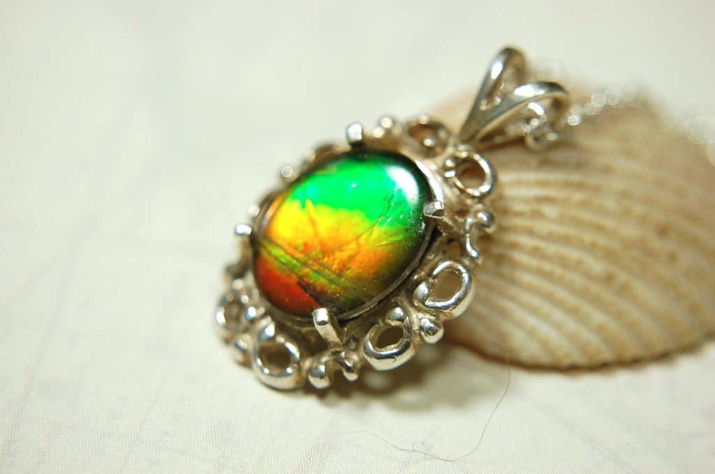 Ammolite pendant petite but powerful impact.Rich Sunset colors.Memorable gift.Fashion accessory.Rare jewelry.022216