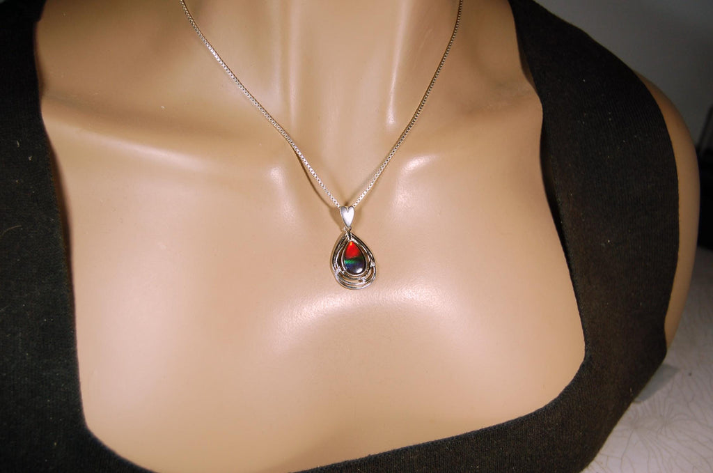 Eye-Catching Ammolite Pendant gift for Mothers Day she will treasure.Genuine Ammolite mined, finished and shipped from Canada 032015