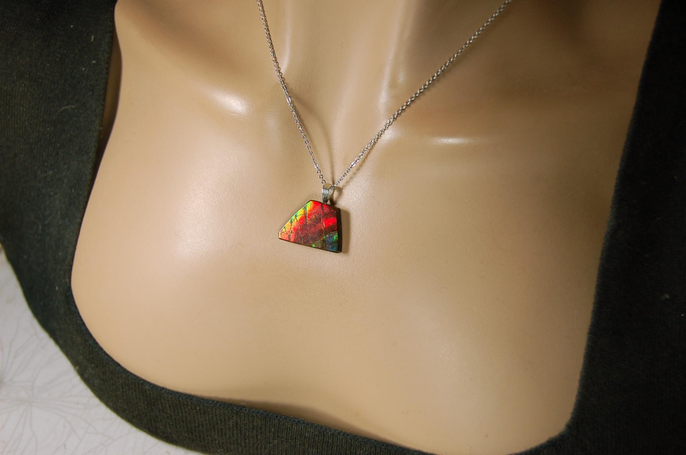 Natural Ammolite pendant with natural cabochon gem mined in Alberta Canada.070915