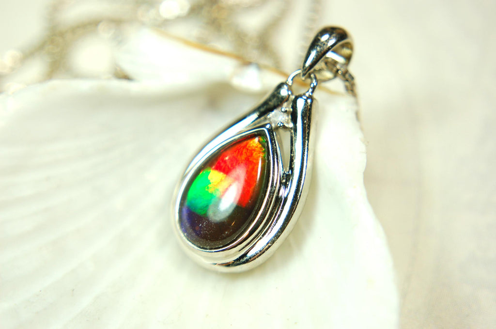 Buy Canadian Ammolite Pendant.Petite but very powerful colors.Perfect gift or gift for wife.Brilliant rainbow colors.Must see video.050429