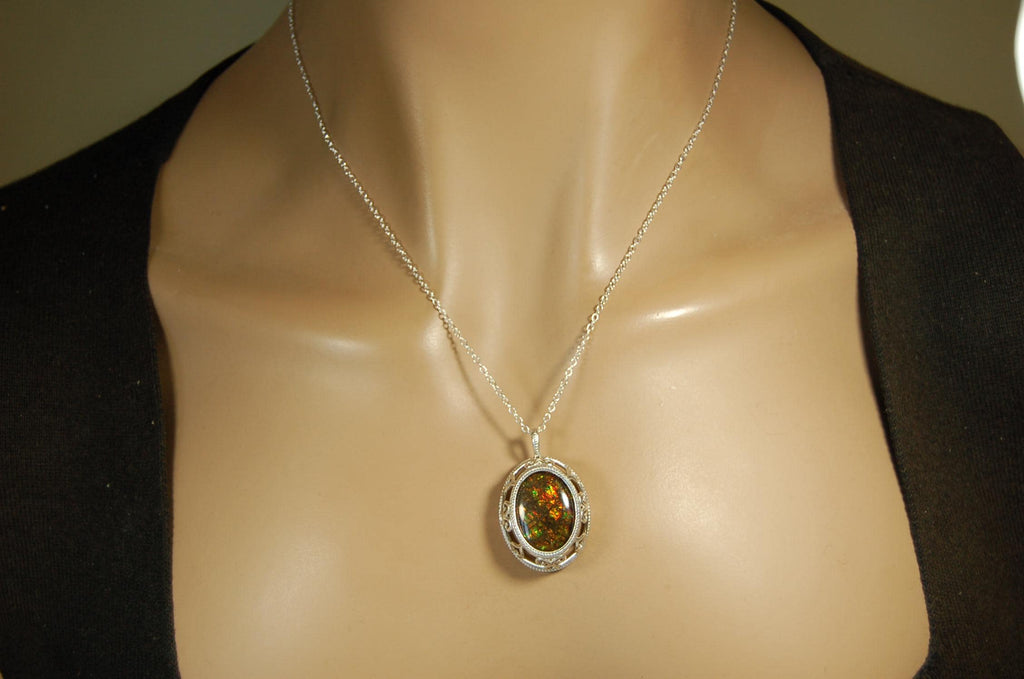 Unusual Ammolite pendant full of multicolor sparkles.A gift that will be treasured..032116