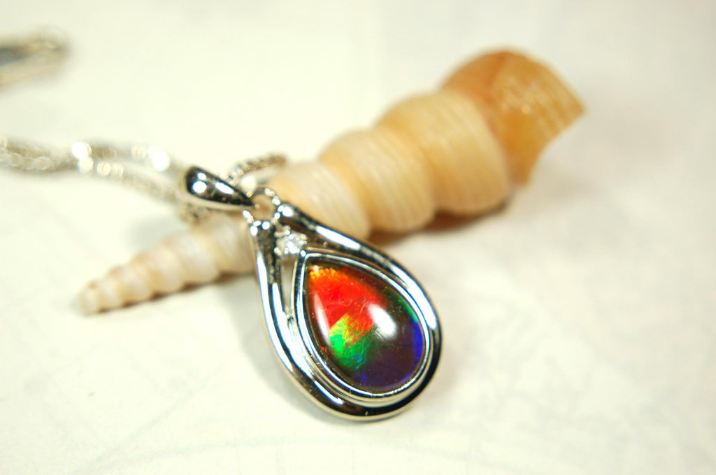 Buy Canadian Ammolite Pendant.Petite but very powerful colors.Perfect gift or gift for wife.Brilliant rainbow colors.Must see video.050429