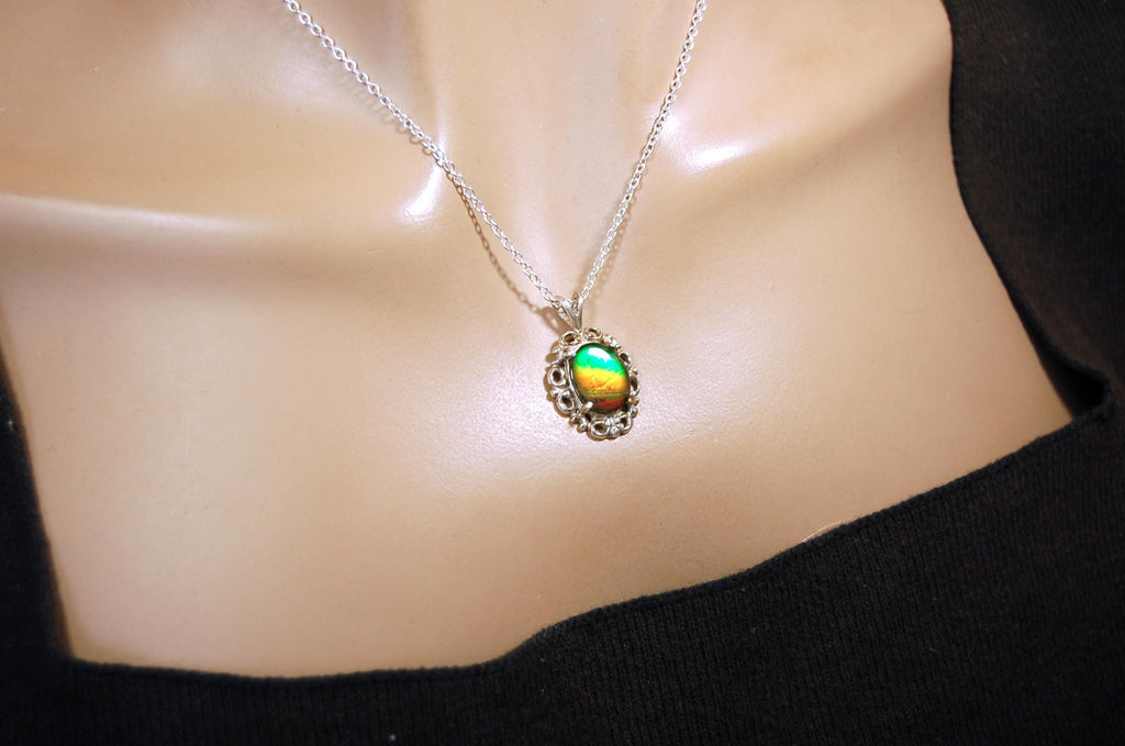 Ammolite pendant petite but powerful impact.Rich Sunset colors.Memorable gift.Fashion accessory.Rare jewelry.022216