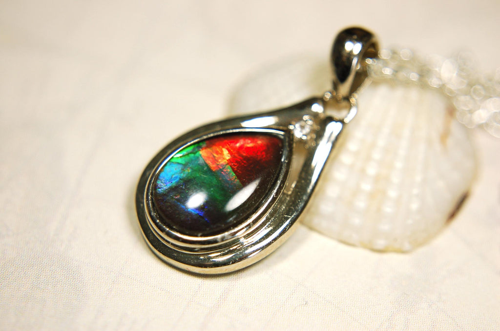 Ammolite pendant.Petite,feminine but very powerful.Rainbow color gem with sapphire.Birthday or Anniversary Gift for wife? 030416