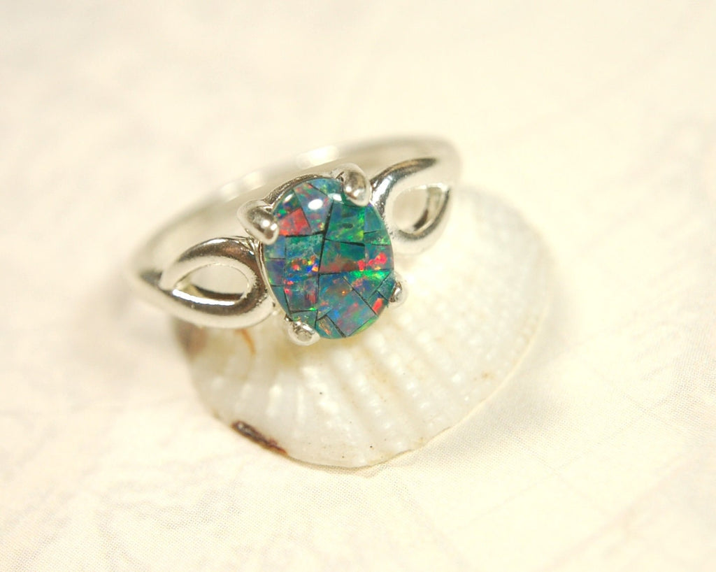 Australian Opal Ring.Gorgeous colors. Set in Sterling Silver.The perfect gift.Size 7 Boho style.