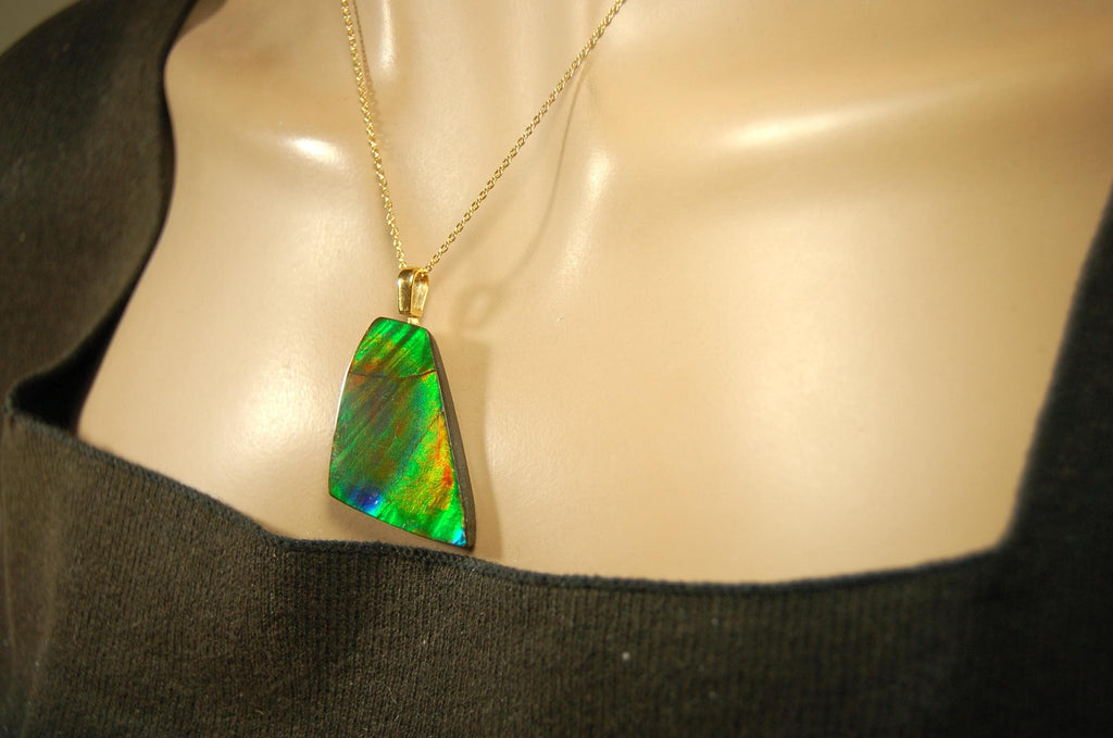 Ammolite Pendant.Natural Cabochon with strong color changing abilities.14kGF Gold bail.Elevate your style.030716