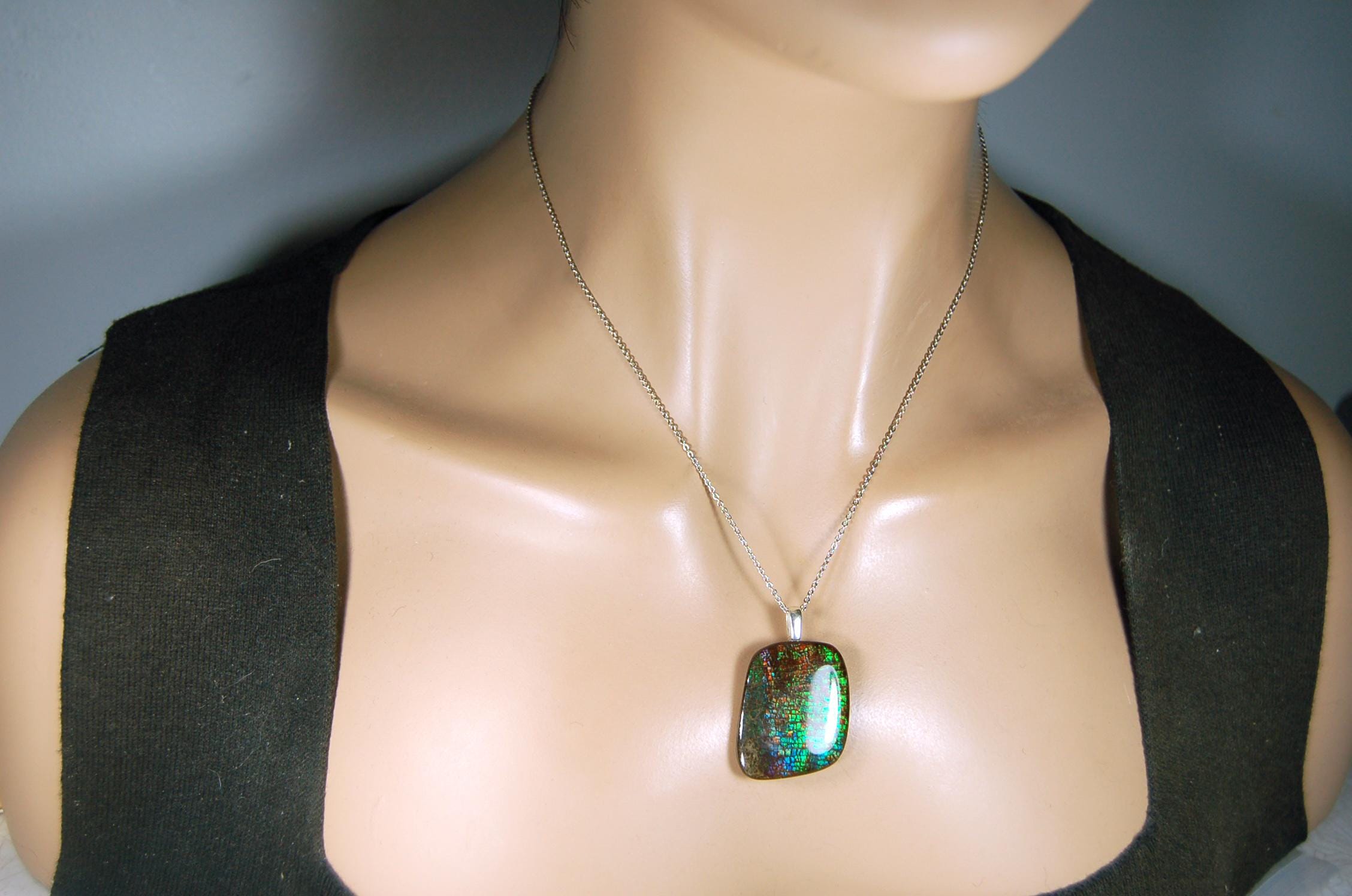 Ammolite Pendant Necklace.RARE Natural gem with brilliant sparks of color on black background.--071815