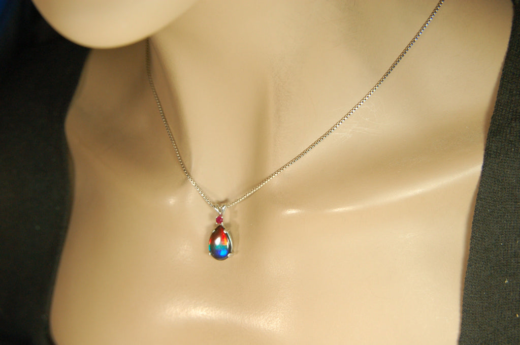 Ammolite Raibow pendant.Natural ruby companion stone.Lots of bright colors.#110317