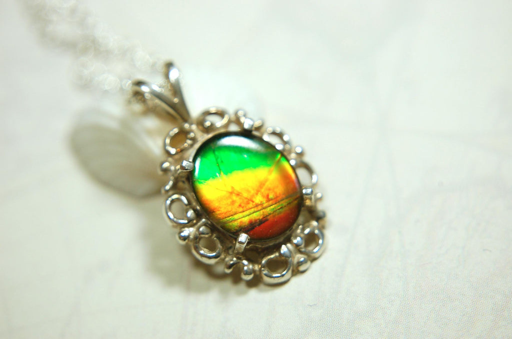 Ammolite pendant petite but powerful impact.Rich Sunset colors.Memorable gift.Fashion accessory.Rare jewelry.022216