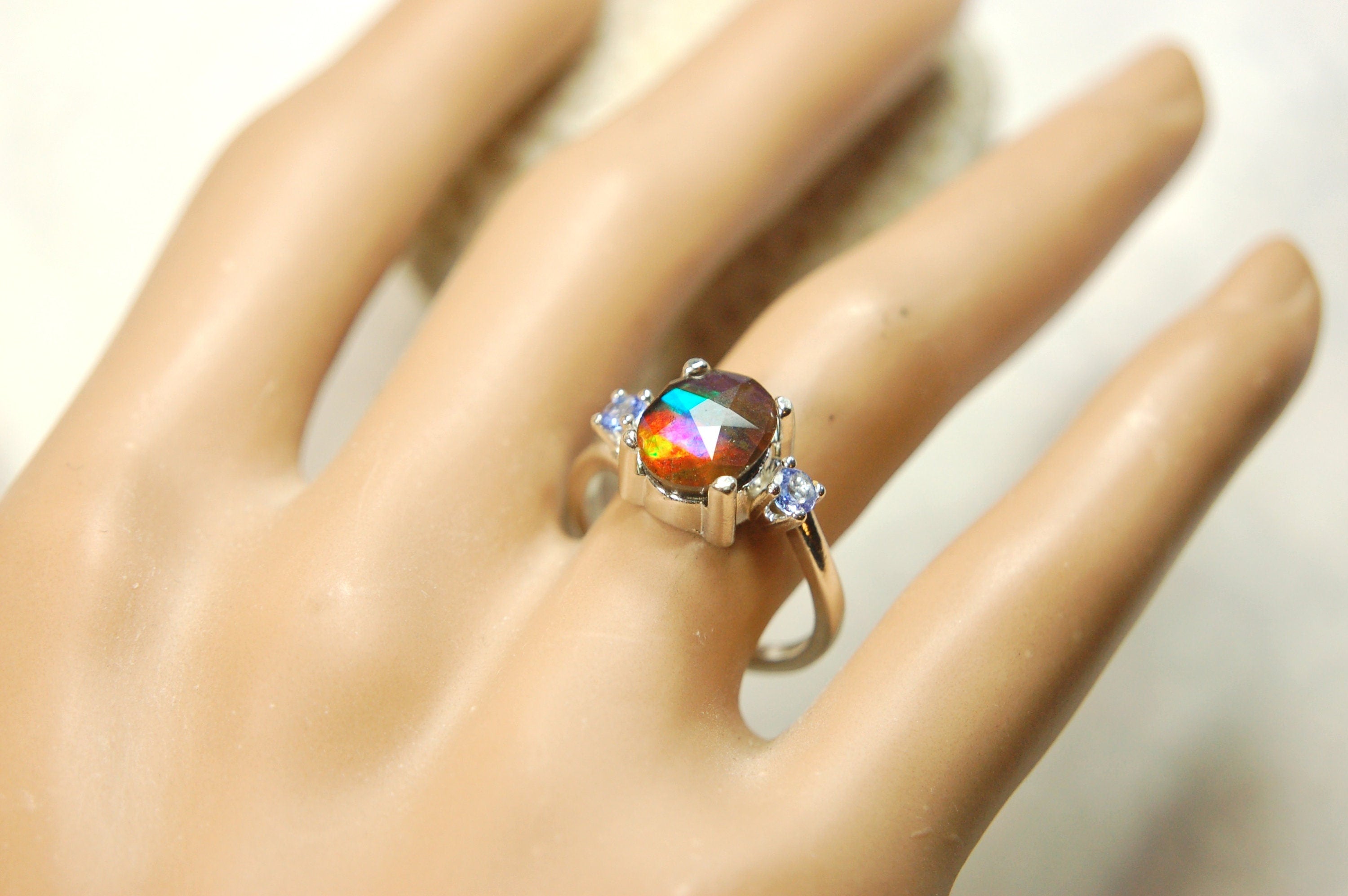 Ammolite Jewelry Ring with Tanzanites.No import taxes under CUSMA rules.022414