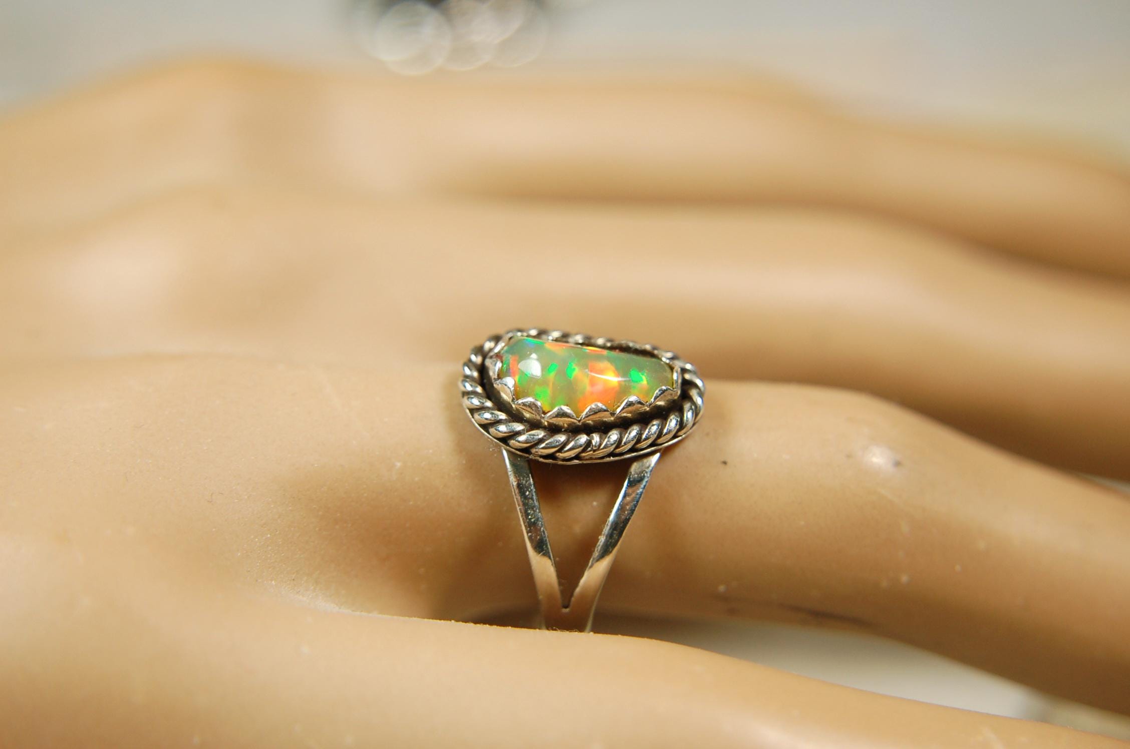 Opal Ring.Genuine untreated Ethiopian Opal.Lovely bright colors when rotated.Size 8.Sterling Silver.053115