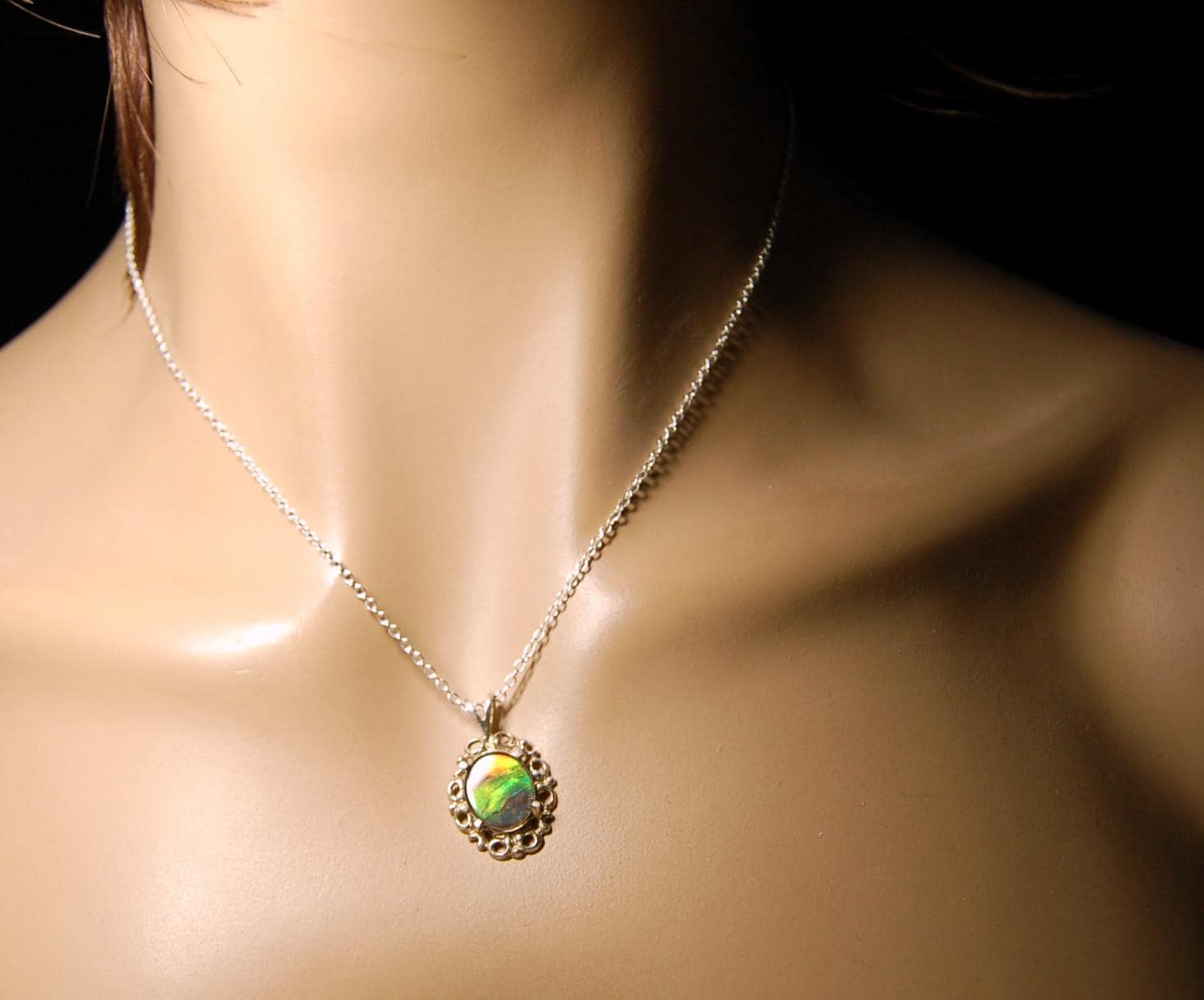 Ammolite Pendant from Alberta Canada.Genuine quality ammolite with warranty.The perfect gift.010926