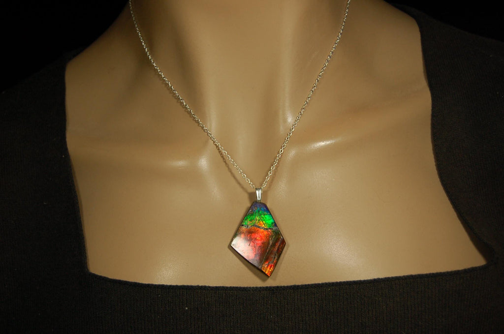 Ammolite pendant necklace.Unique raw natural cabochon with brilliant varied colors.Unisex design.Boho jewelry.031716