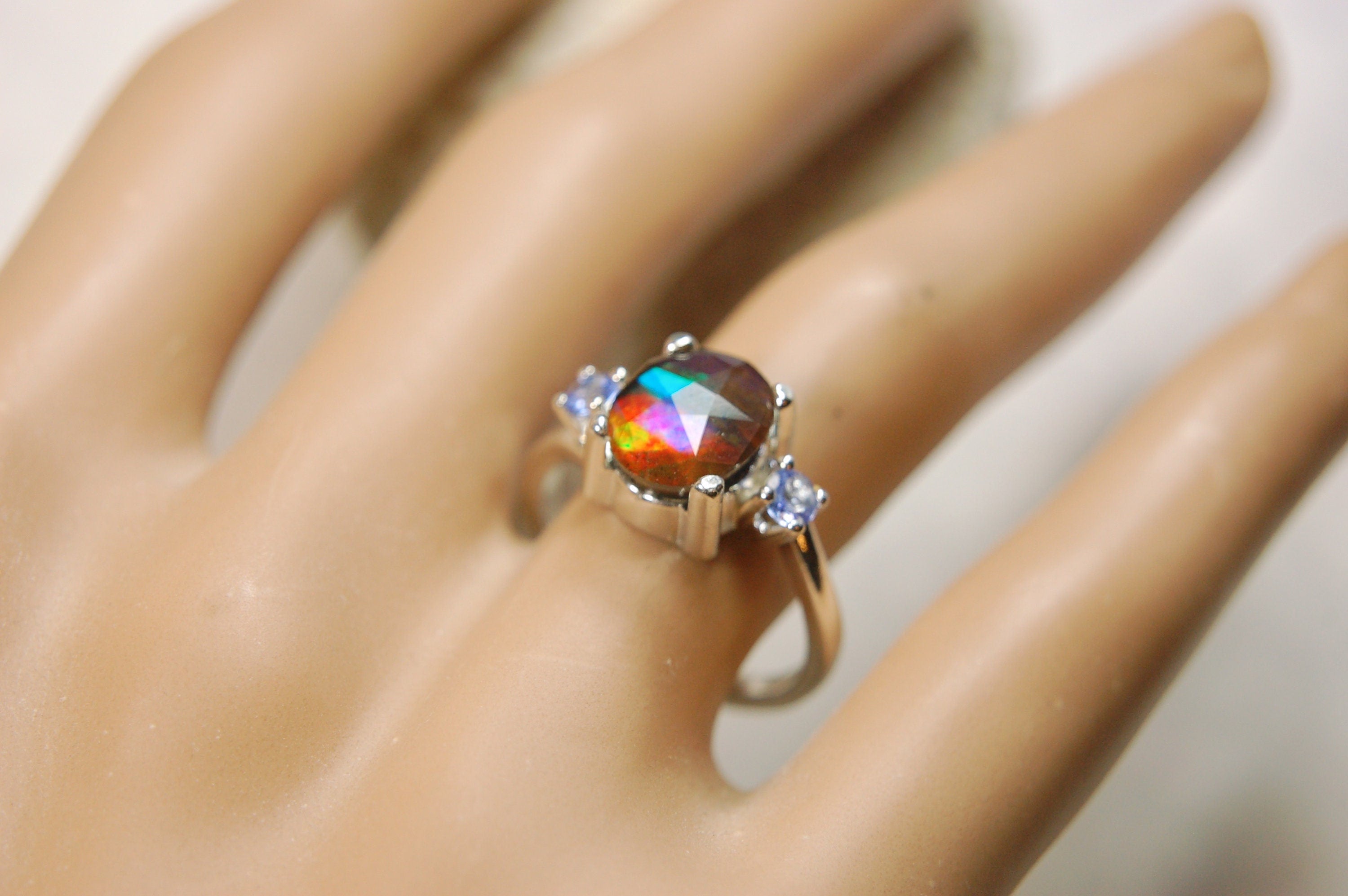 Ammolite Jewelry Ring with Tanzanites.No import taxes under CUSMA rules.022414
